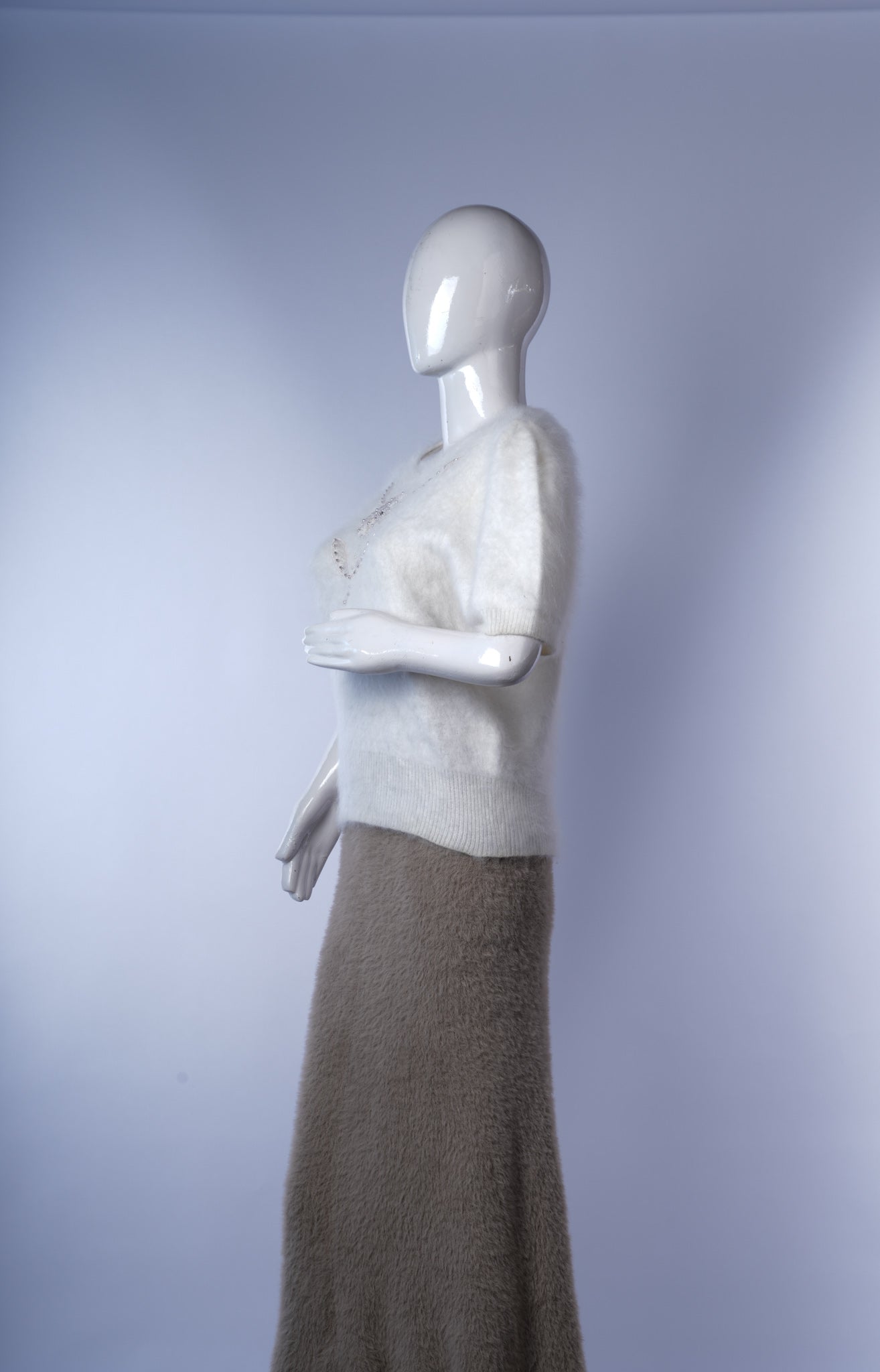 Short-sleeve fuzzy sweater adding subtle sparkle and texture to everyday outfits.