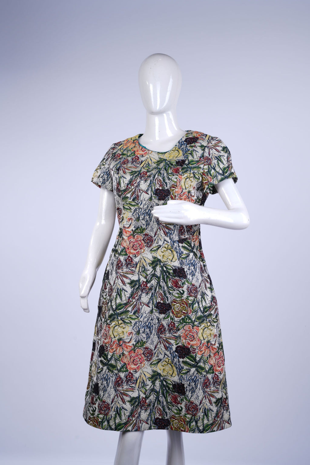 Floral-print one-piece dress in soft cream, knee-length, ideal for summer or casual wear.