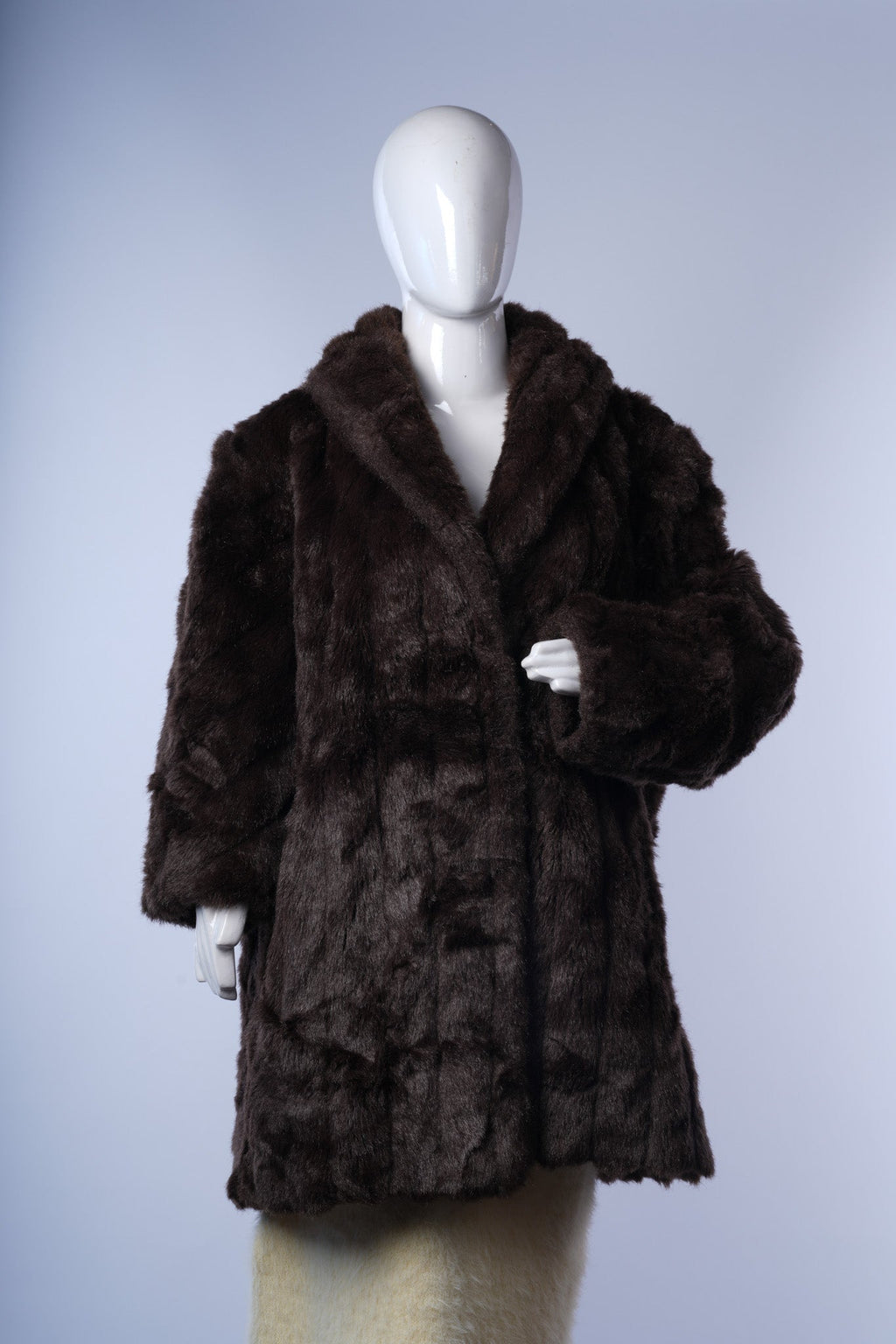 women's mid- to knee-length dark brown faux-fur jacket ideal for elegant winter layering.