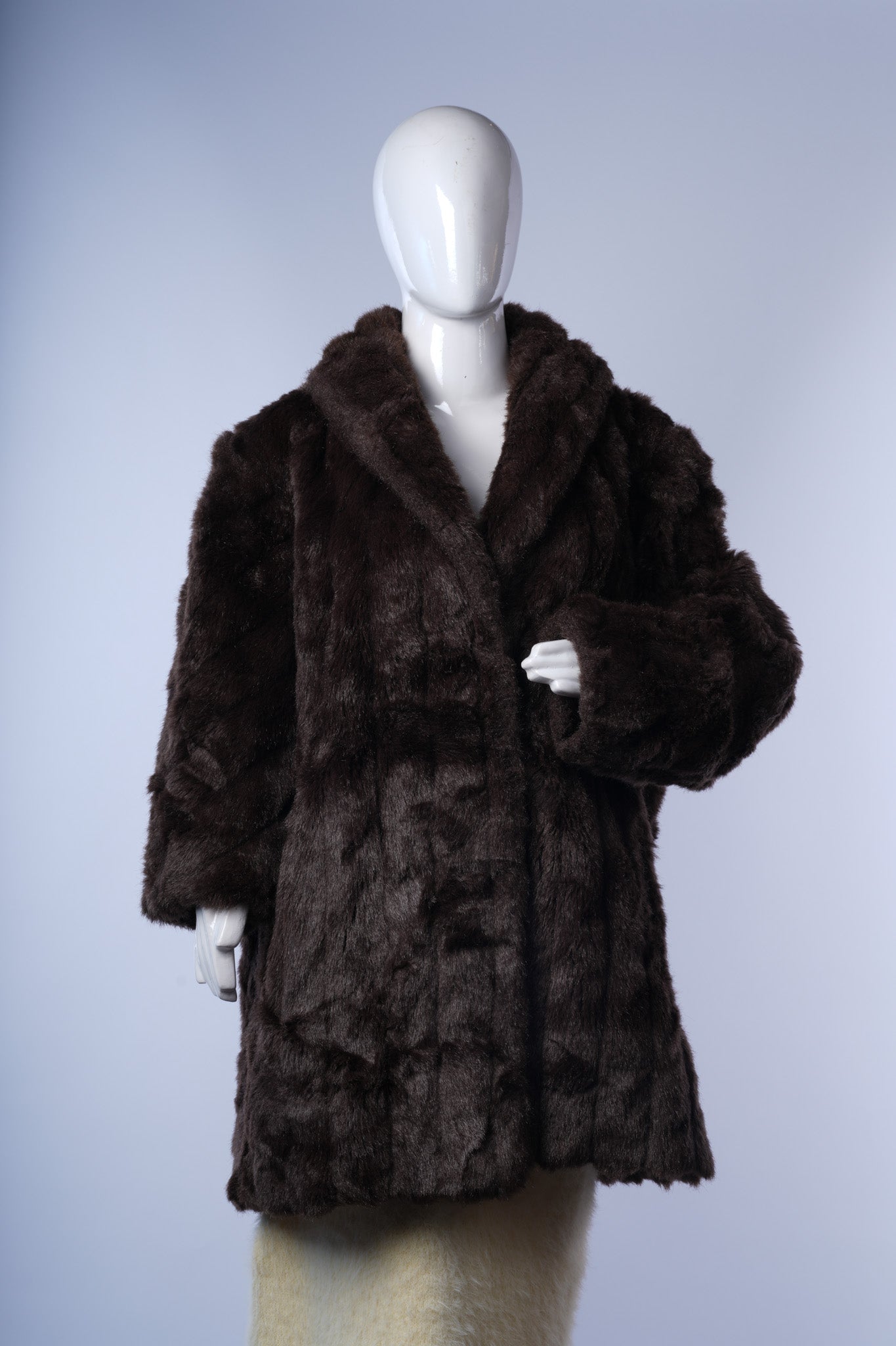 women's mid- to knee-length dark brown faux-fur jacket ideal for elegant winter layering.