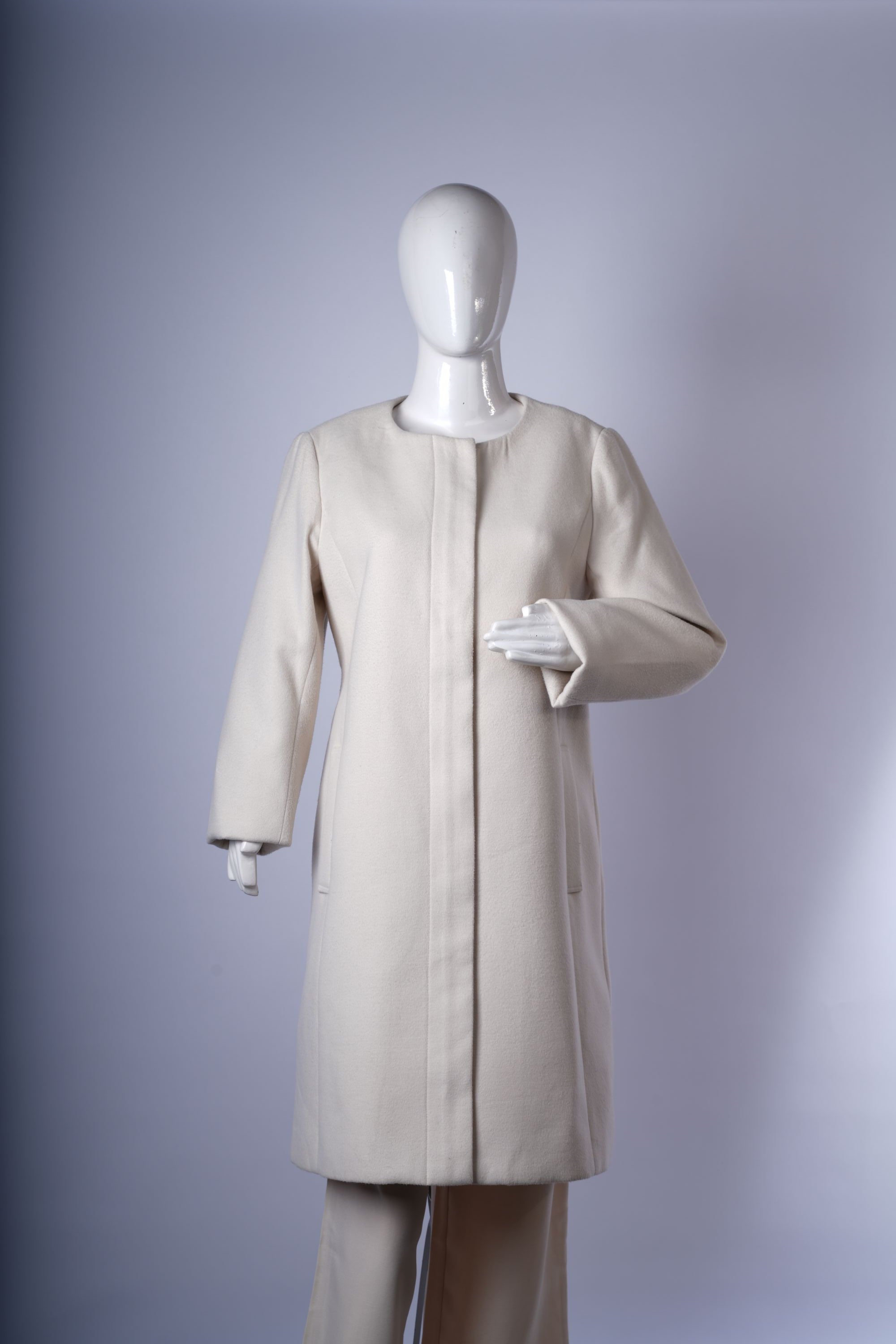 women's minimalist off-white jacket ideal for layering over casual or smart outfits.