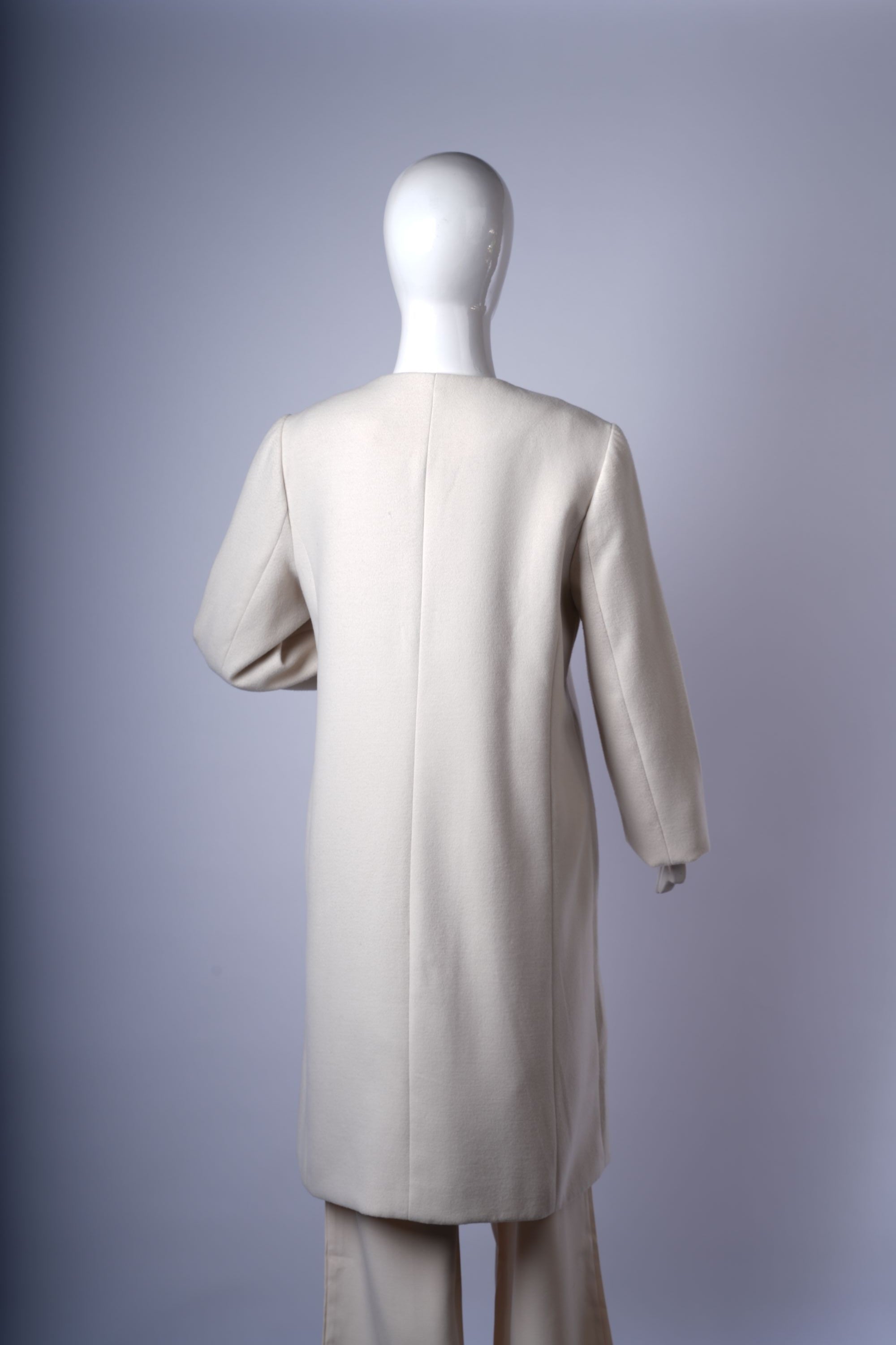 Stylish collarless off-white jacket perfect for versatile everyday layering.