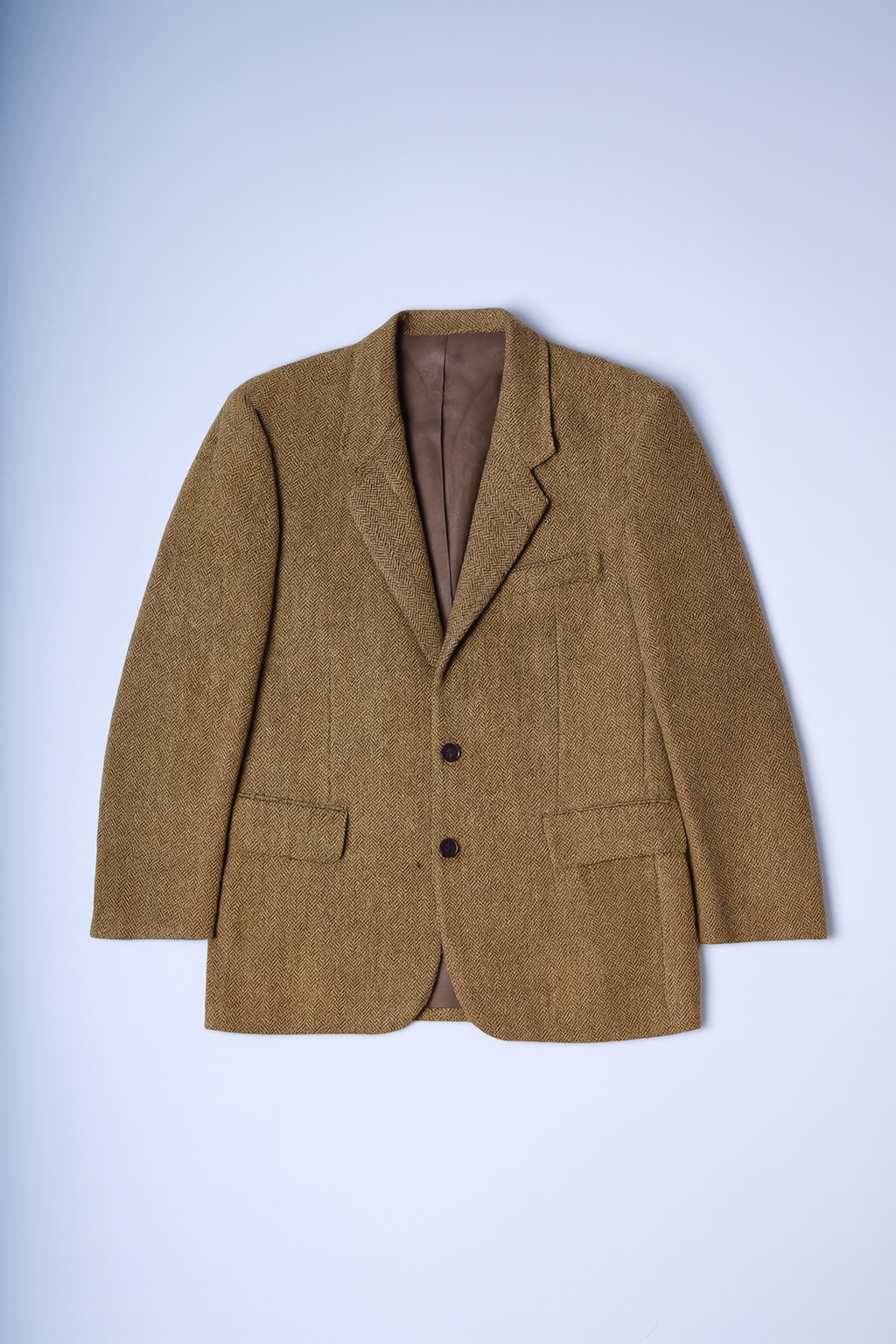 women's single-breasted blazer with notched lapels, two-button closure, and flap pockets.