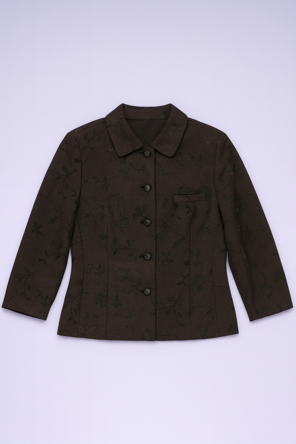 Tailored jacket with lapel collar, button-front closure, and intricate all-over floral pattern.