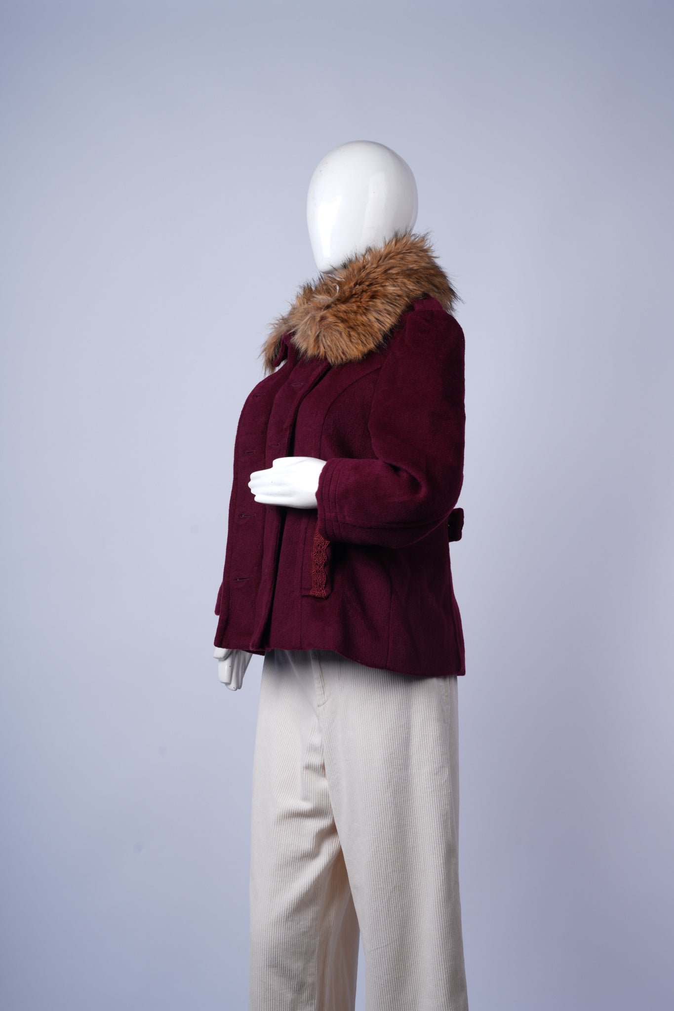 Classic wool-blend coat in maroon with warm design and sophisticated detailing.