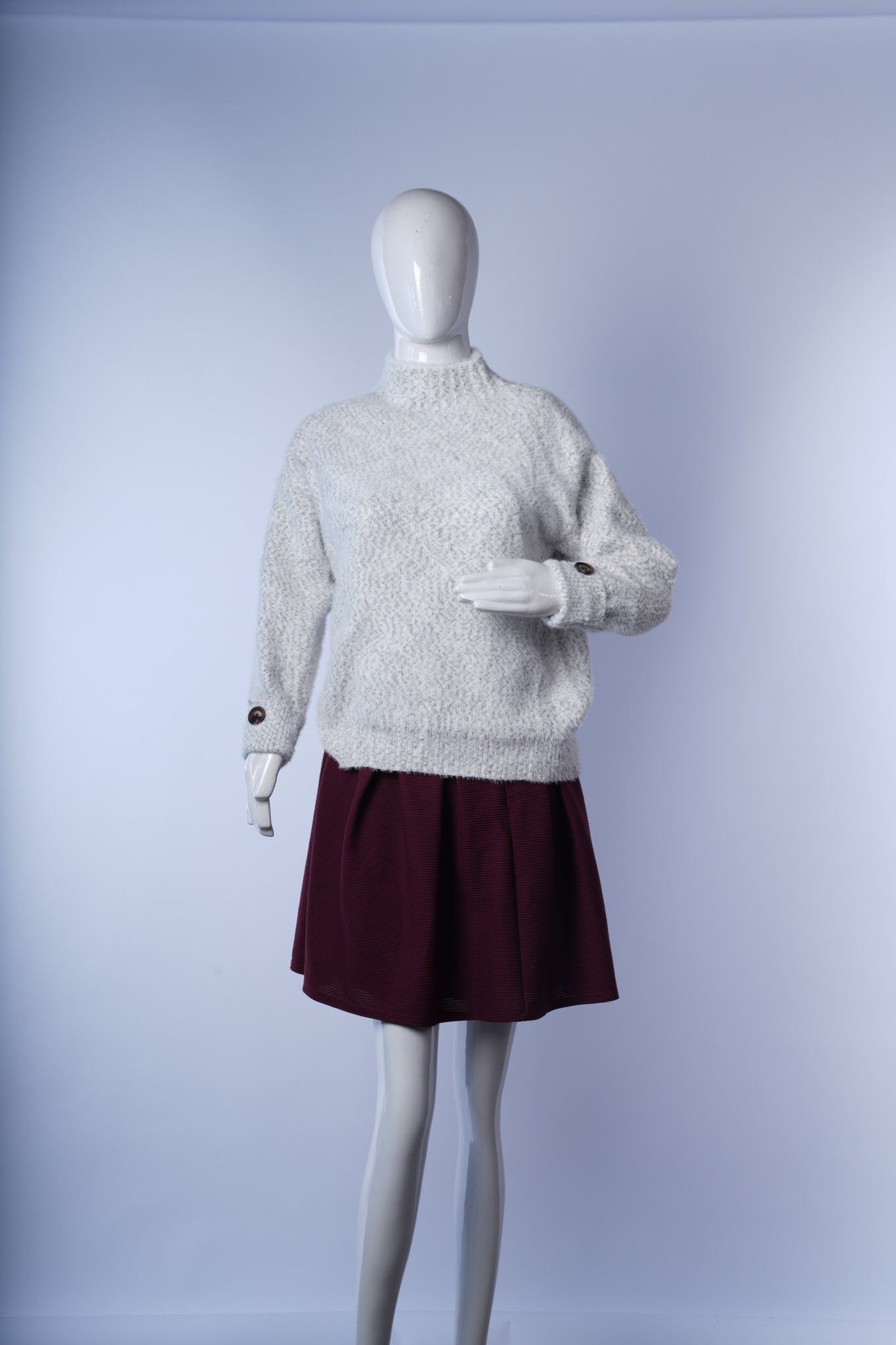Cozy high-neck white winter sweater with ribbed cuffs