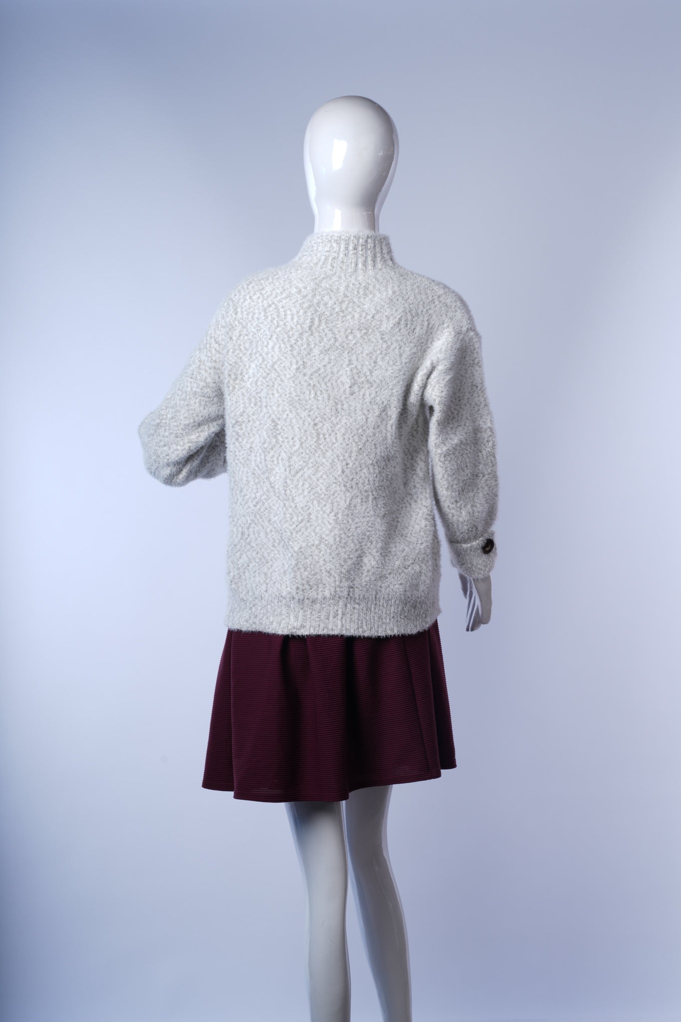 Warm textured knit women's sweater with sleeve button detail