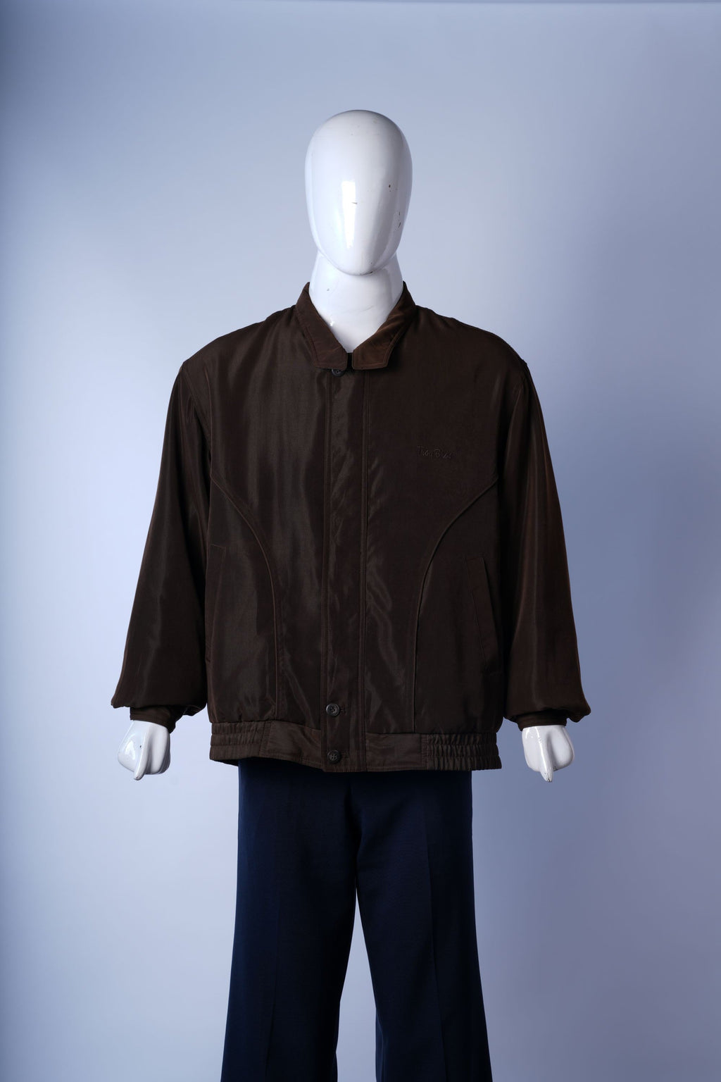 Men?s casual brown bomber featuring plaid collar lining and comfortable fit.