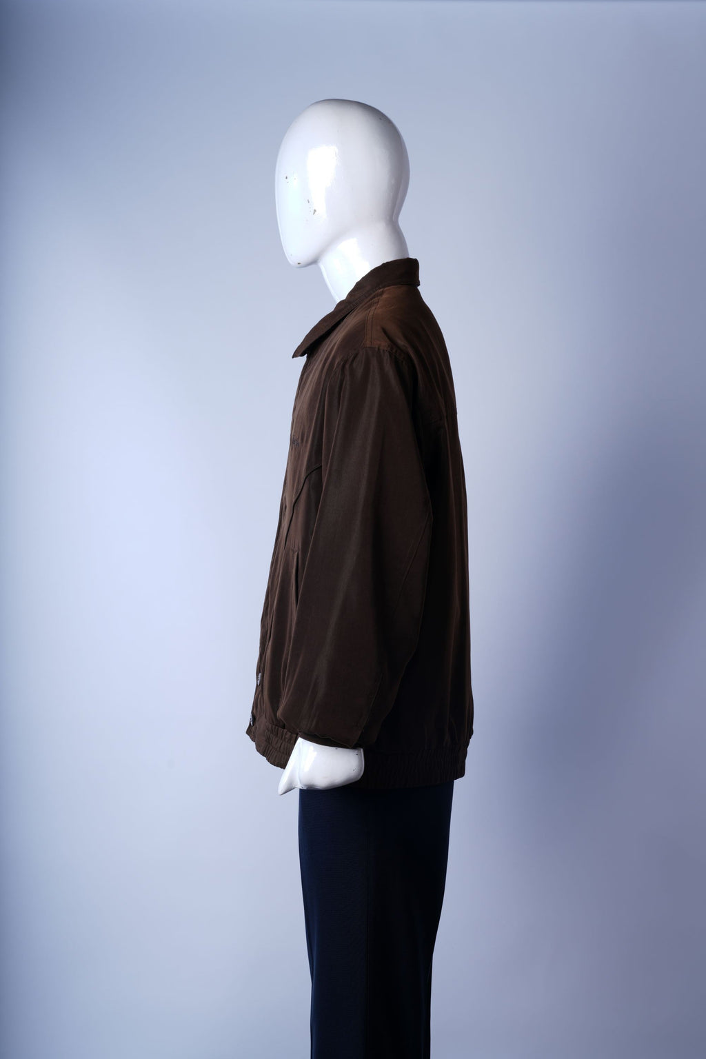Stylish brown bomber jacket with ribbed trims and functional pockets for everyday wear.