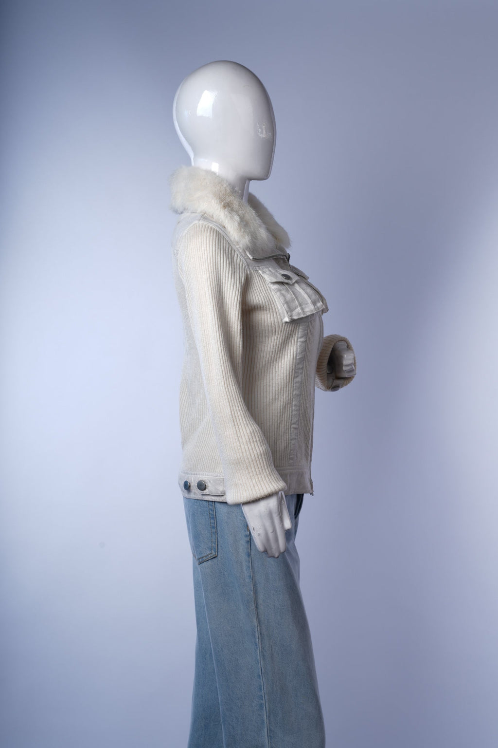 Stylish women's off-white outerwear with ribbed detailing and warm faux fur collar.