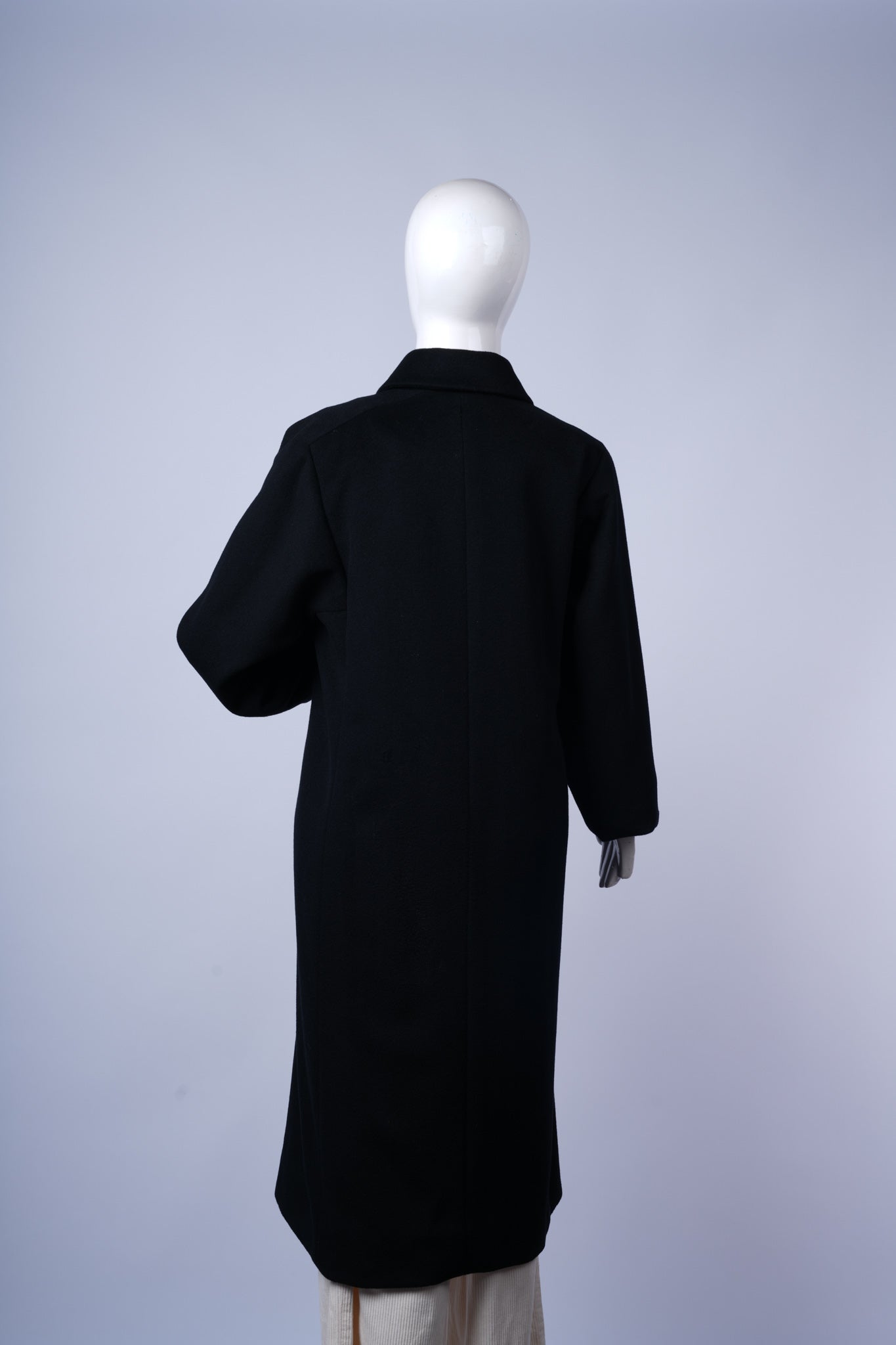 Timeless mid-length overcoat for elegant winter styling