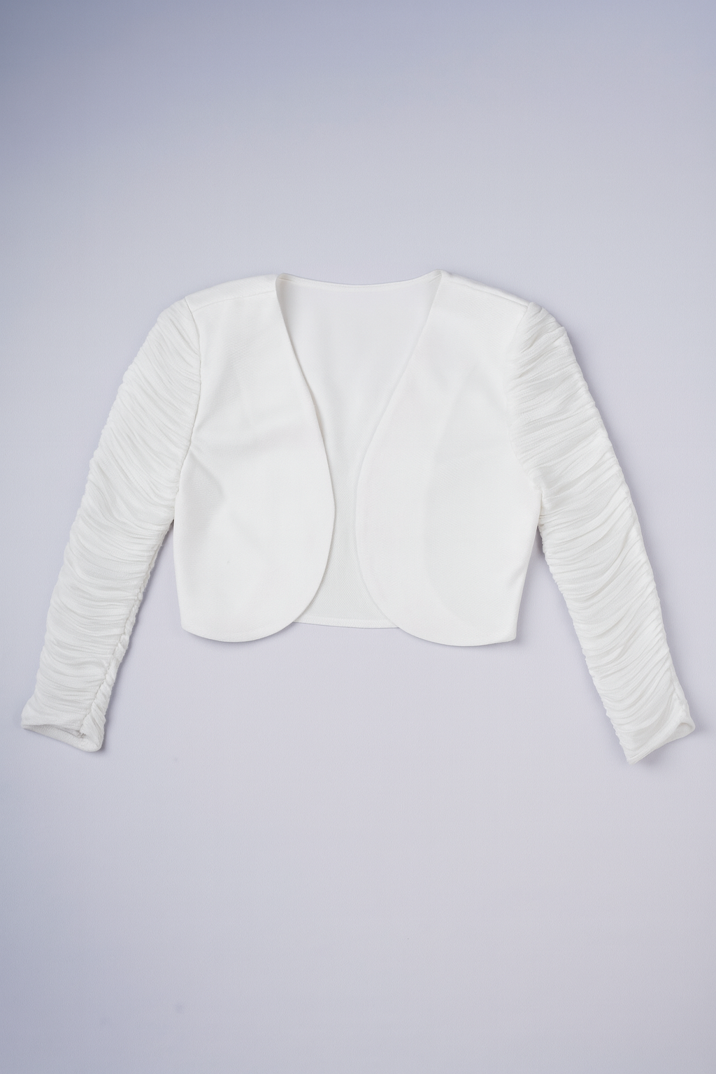 Women’s crisp white cropped jacket with ruched sleeves and collarless design