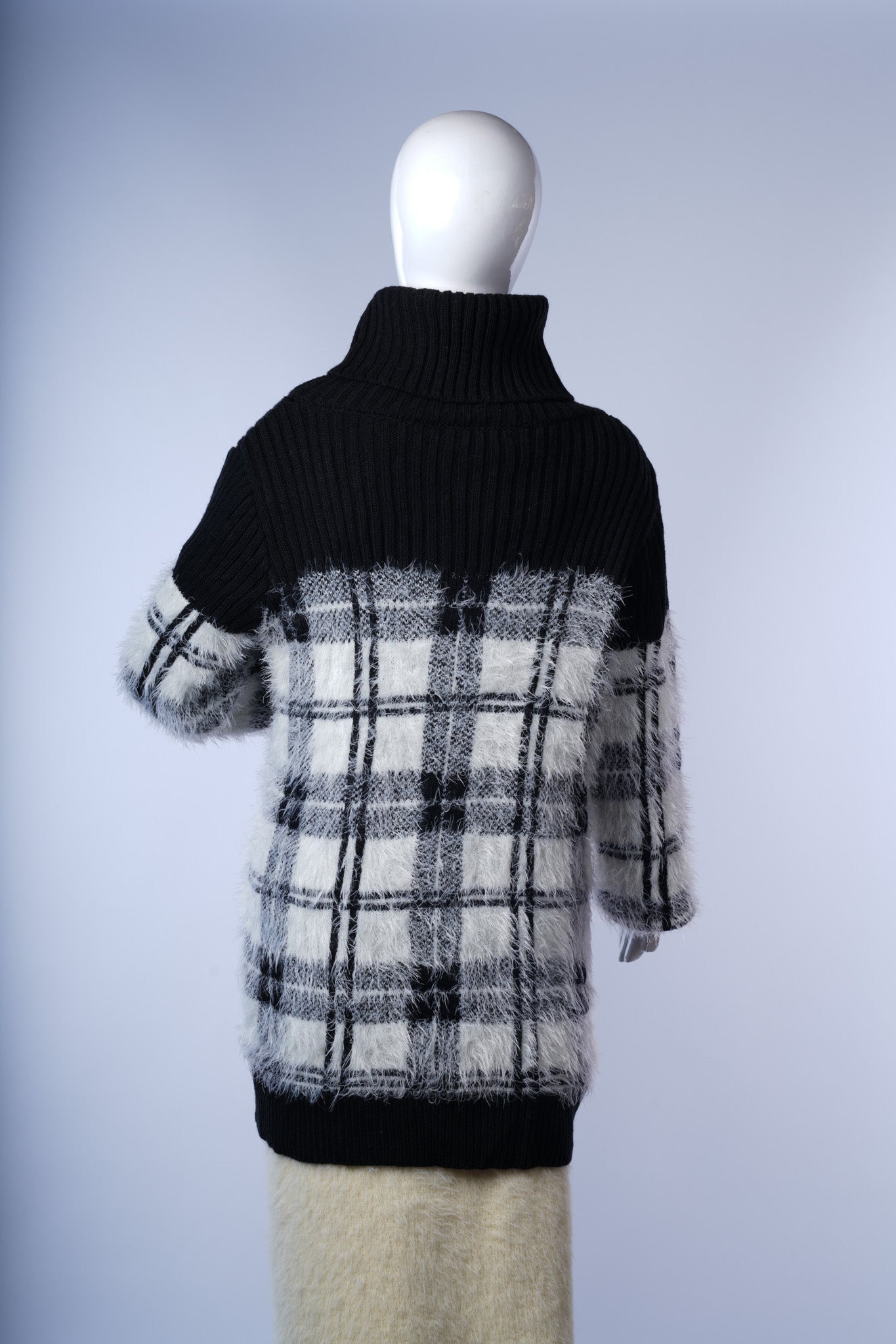 Warm plaid turtleneck dress perfect for stylish layering in fall or winter.