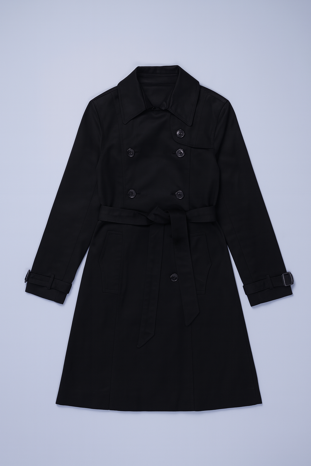 Black double-breasted trench coat with notched lapels and knee-length silhouette.