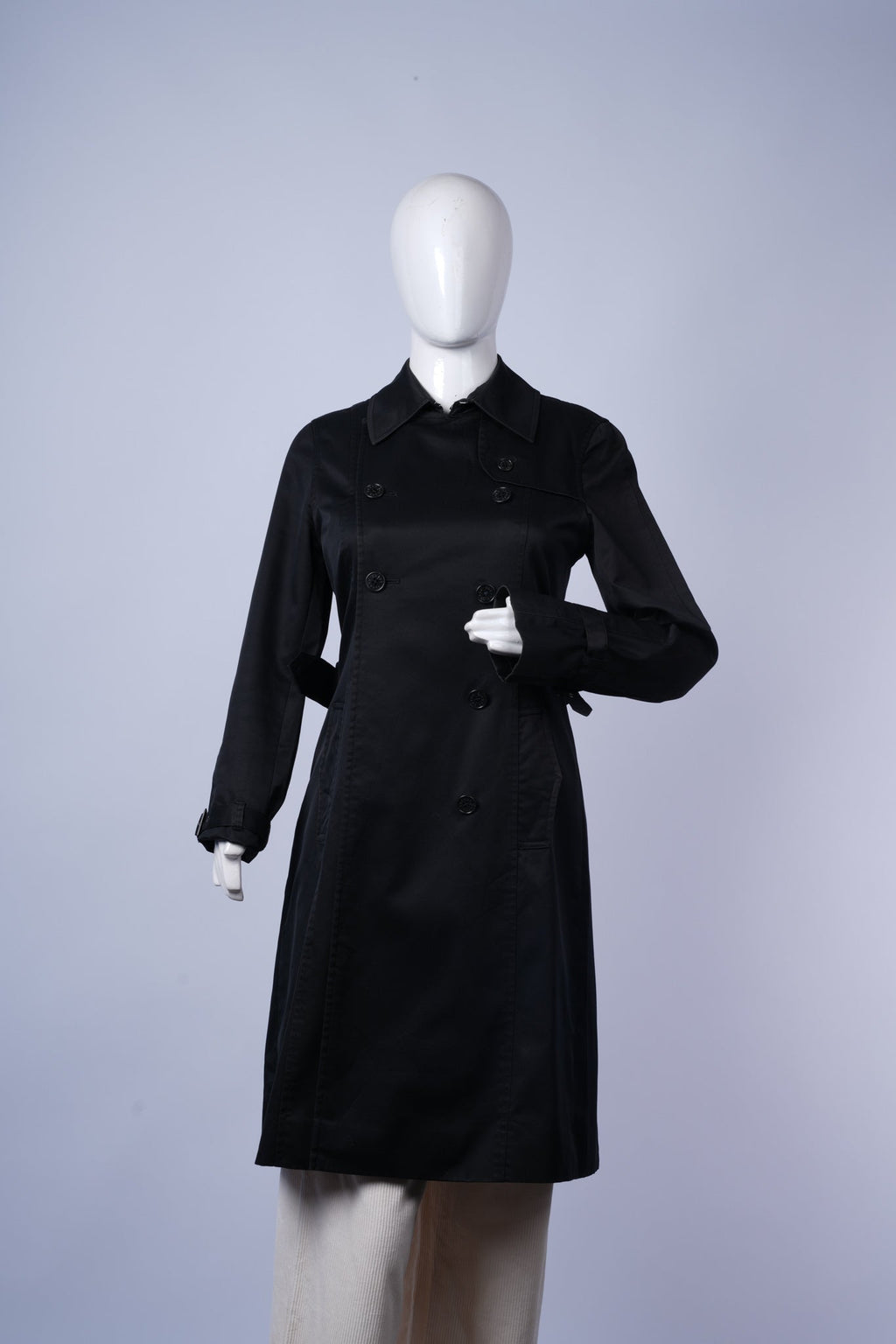 women's sophisticated black trench coat featuring durable fabric and tailored design.