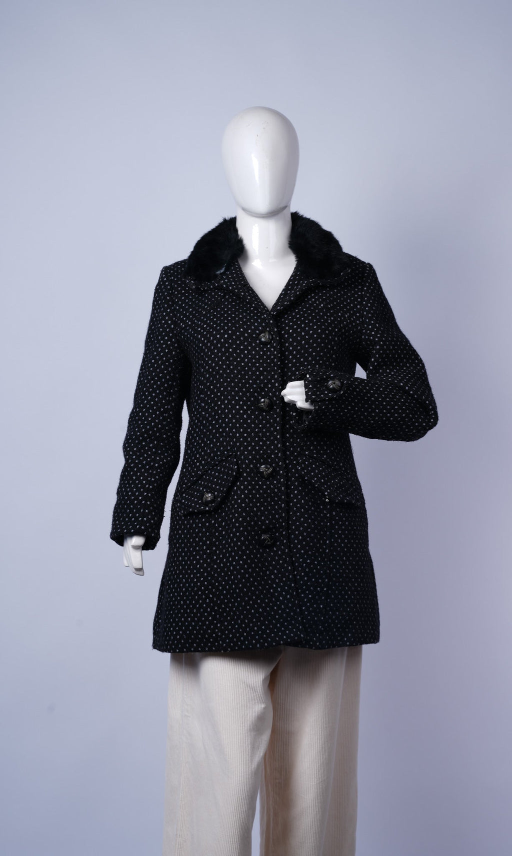 women's stylish black coat featuring vintage-inspired design and cozy fur collar.