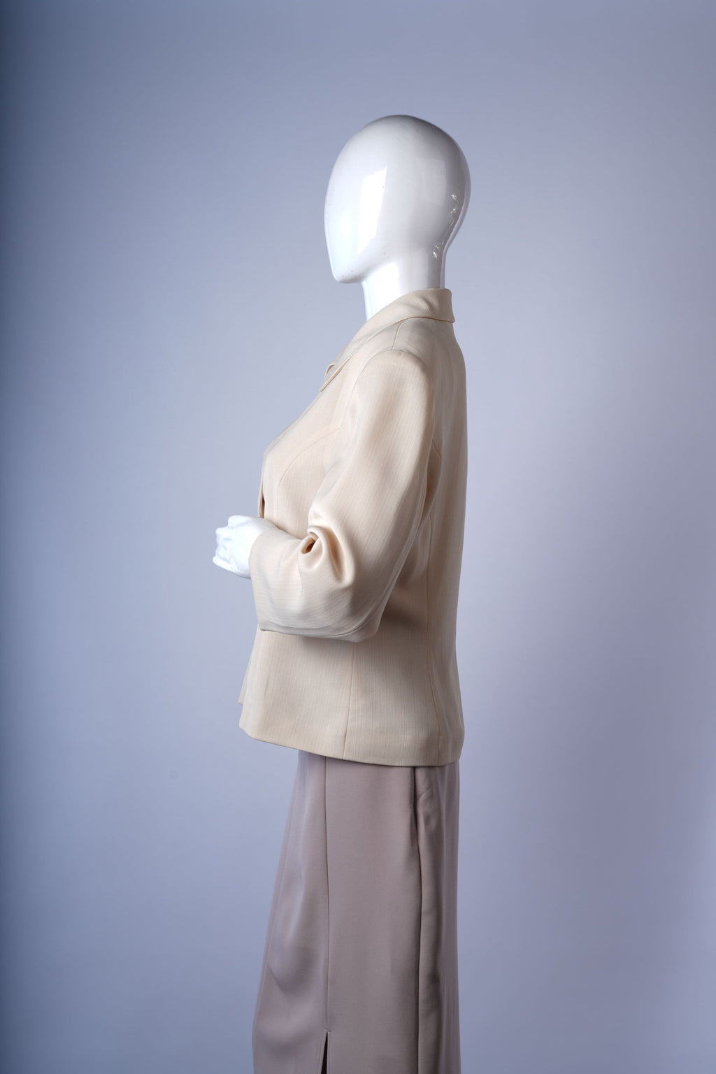 Elegant beige blazer featuring classic tailored design and clean silhouette.