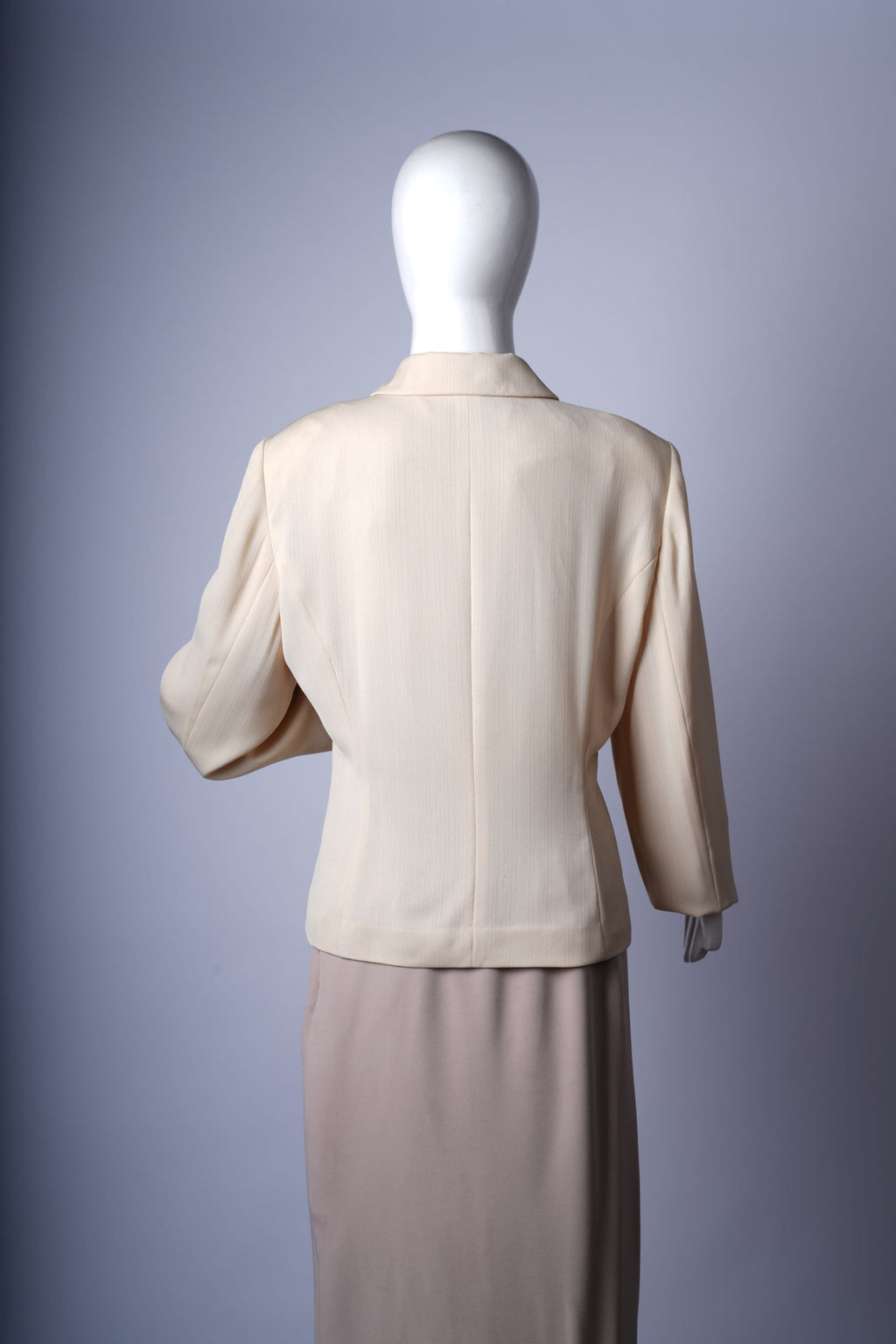 Versatile beige blazer with flap pockets and notched lapels for polished outfits.