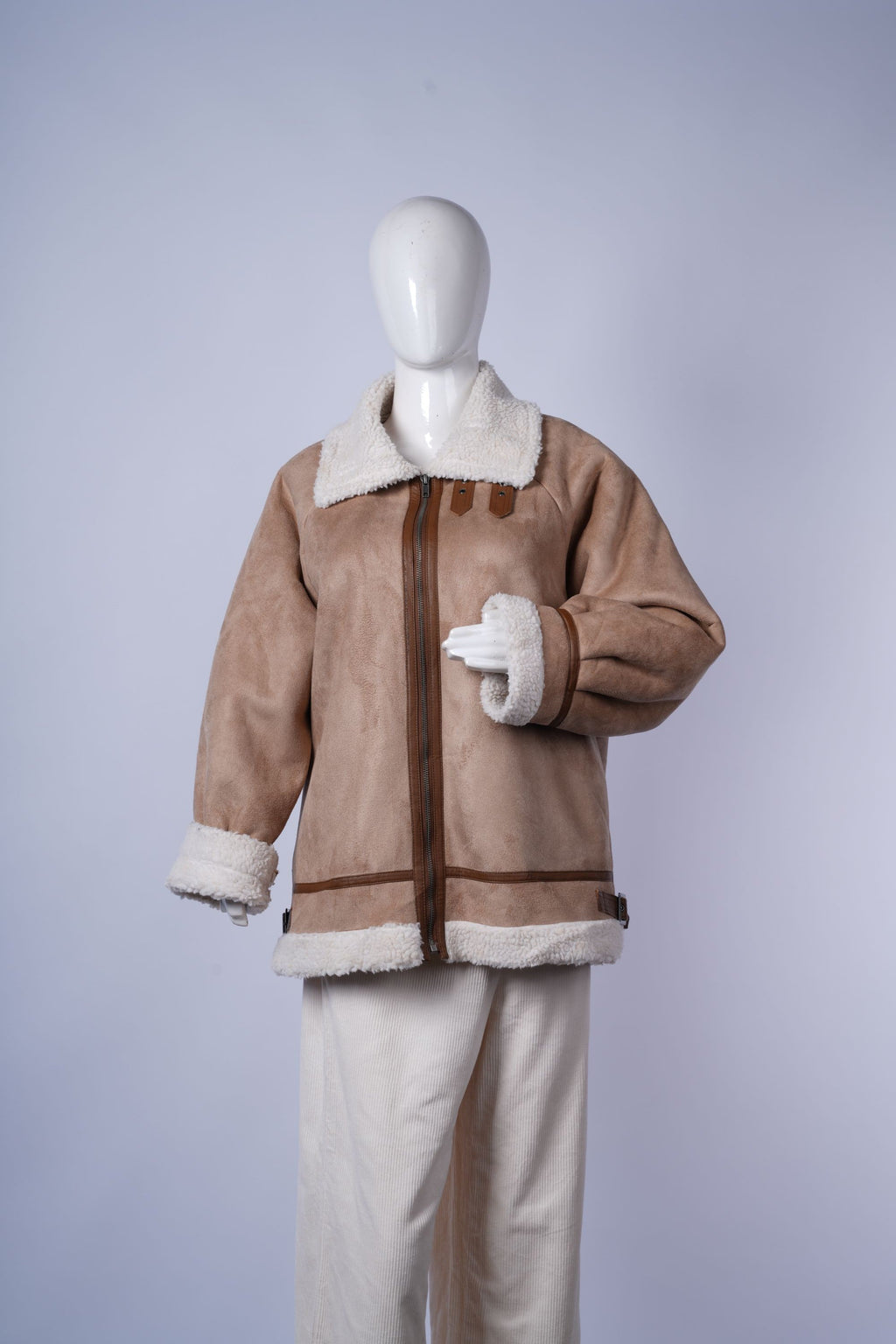 women's cozy faux shearling jacket ideal for layering in colder weather.