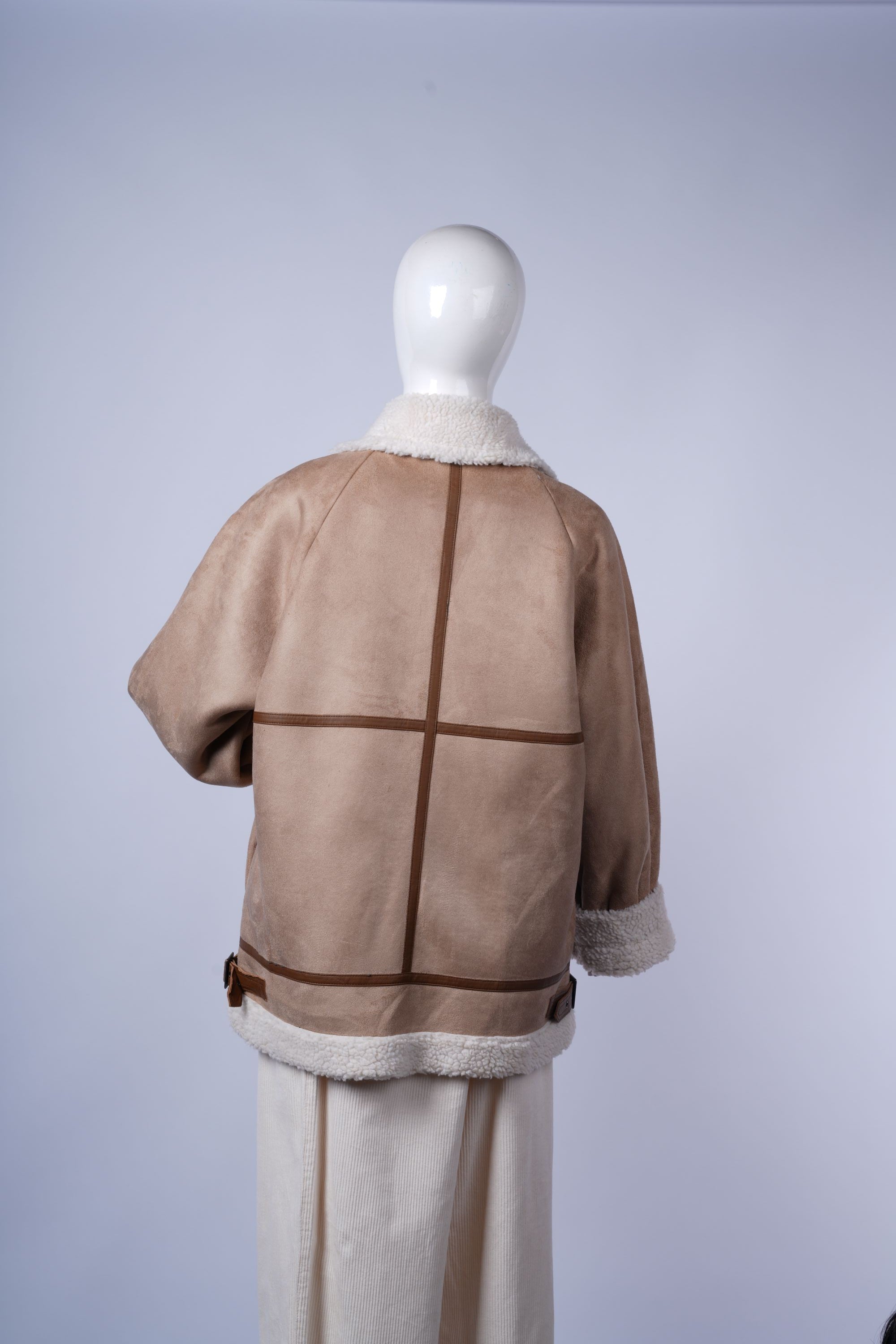 Soft faux shearling jacket with high collar, perfect for winter outfits.