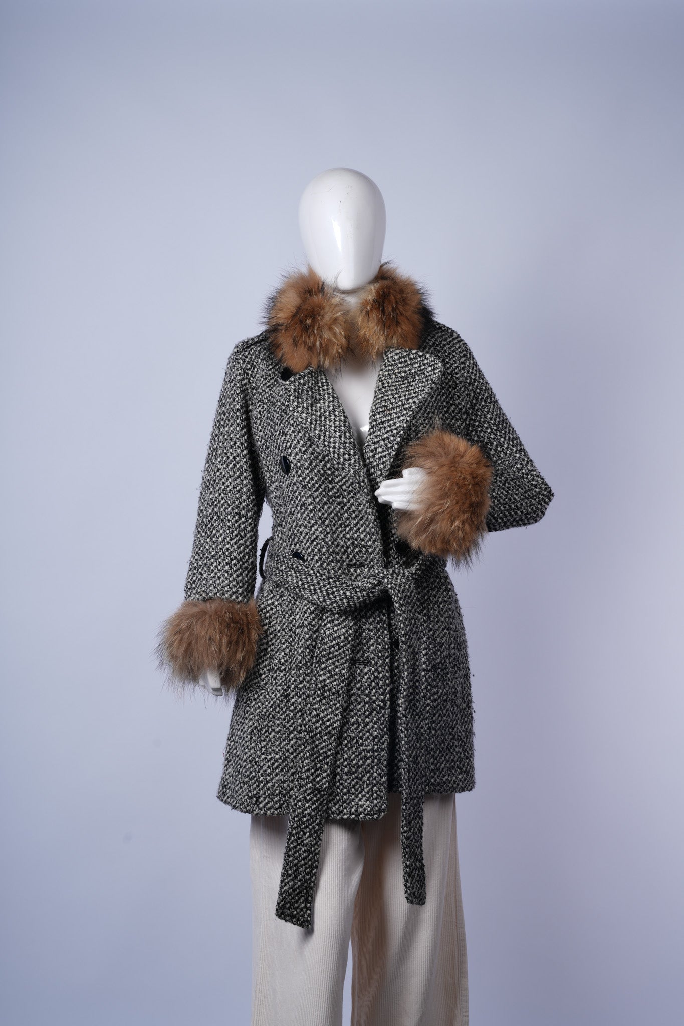 women's elegant pea coat featuring luxurious fur trim and classic winter styling.
