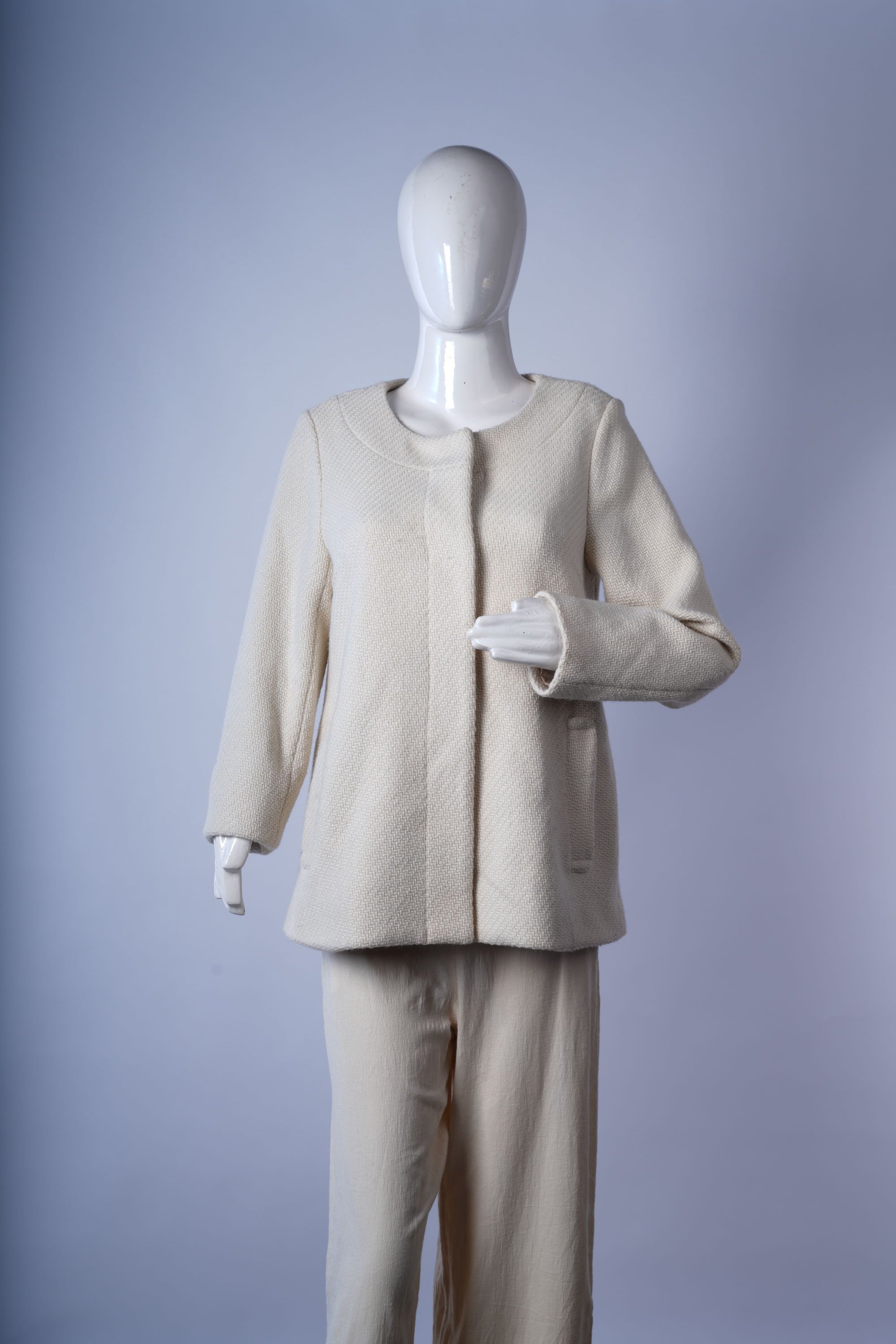 women's tailored black coat with three-button closure for formal office outfits.