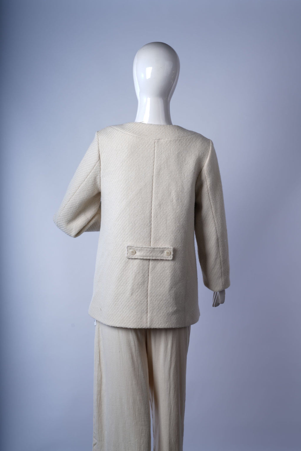 Polished black three-button coat suitable for professional and smart-casual styling.