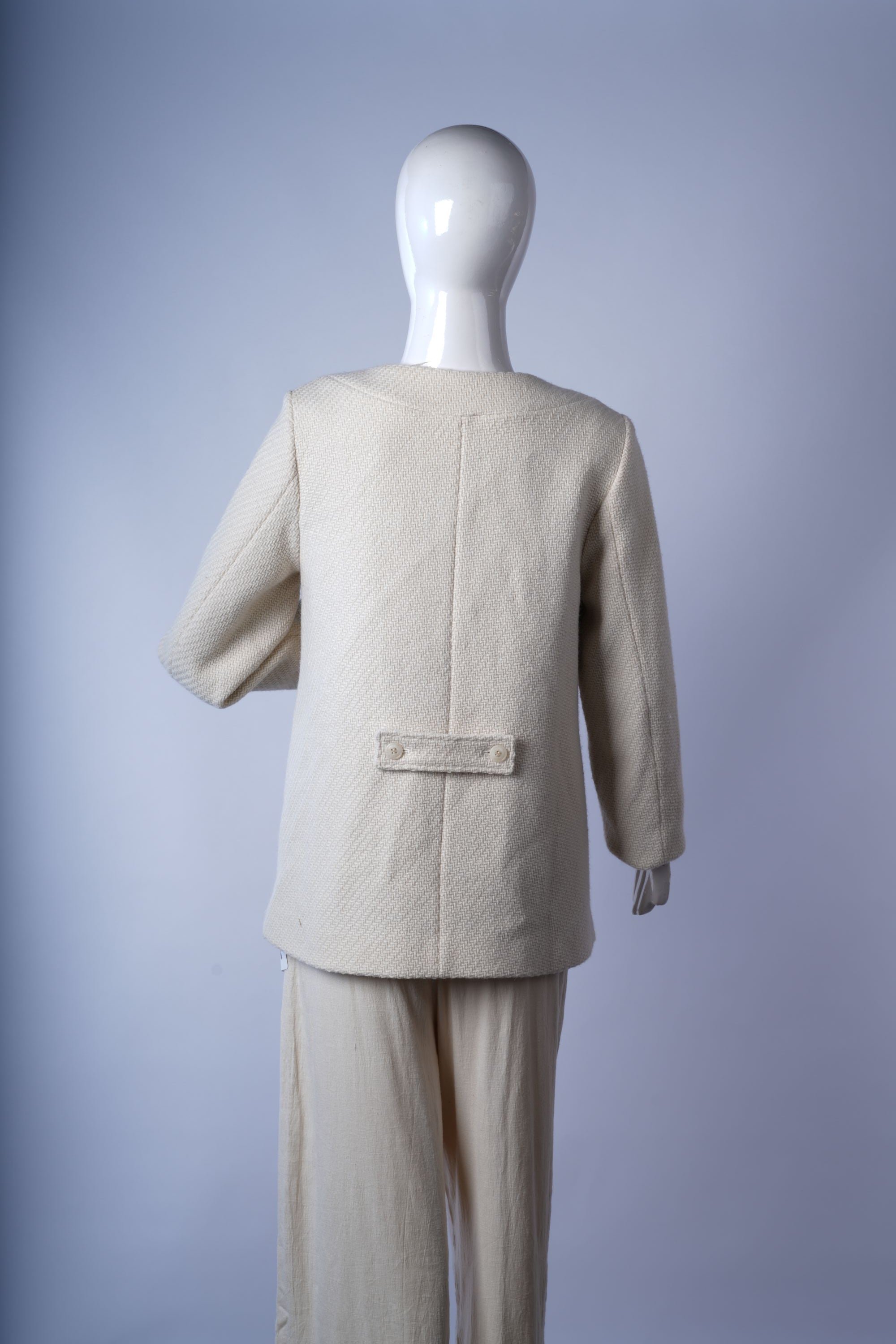 Polished black three-button coat suitable for professional and smart-casual styling.