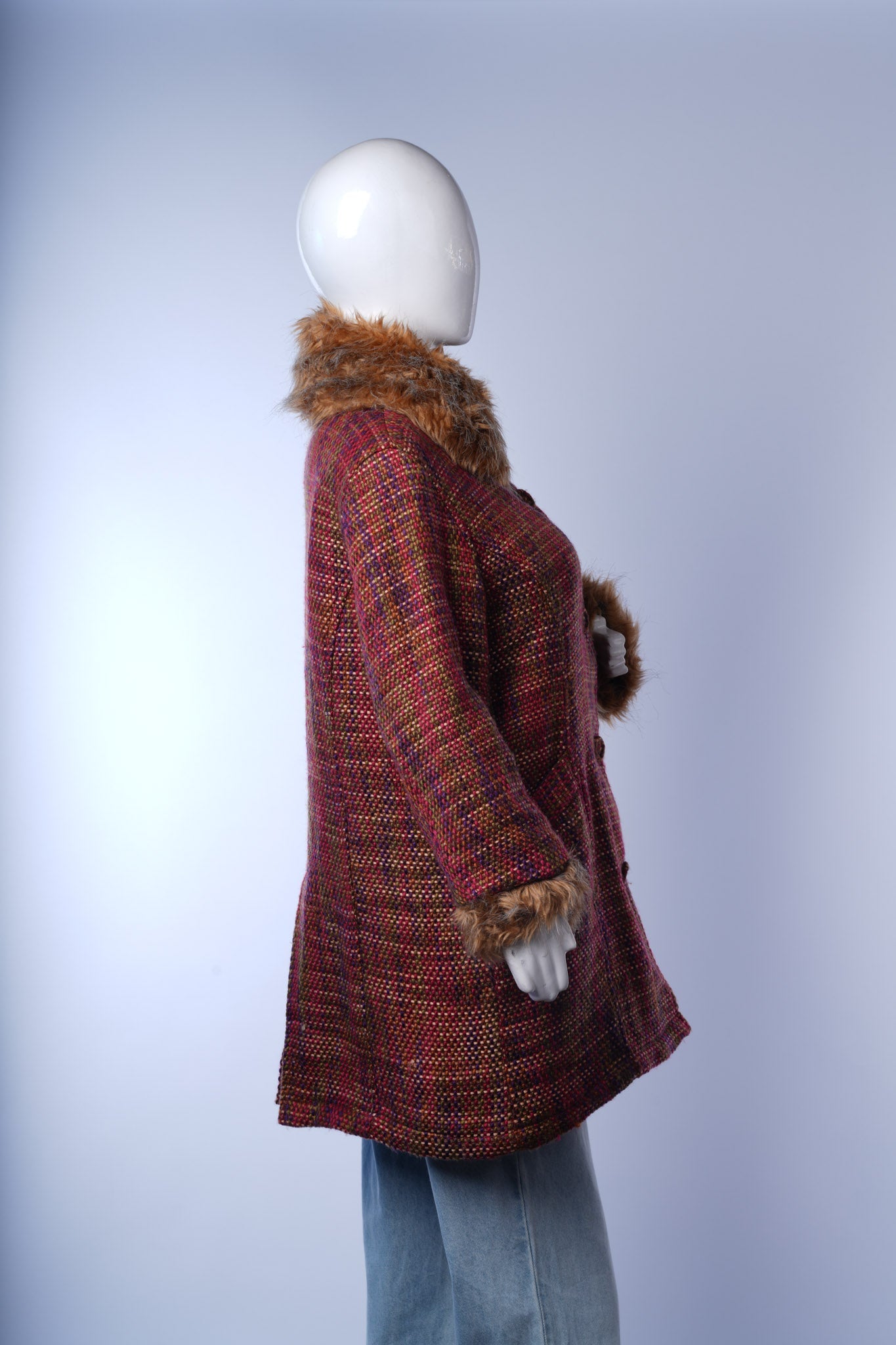 Vintage-inspired FFM tweed winter coat with luxurious fur-trimmed details.