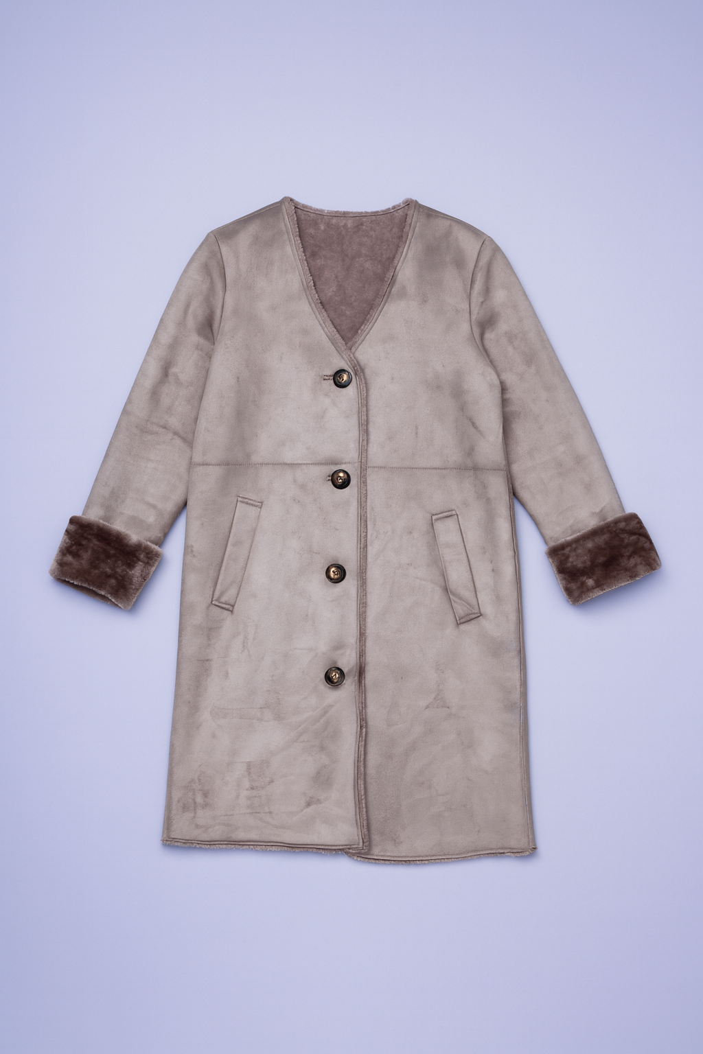 Beige jacket with sueded exterior, plush dark fur lining, button-front closure, and patch pockets.
