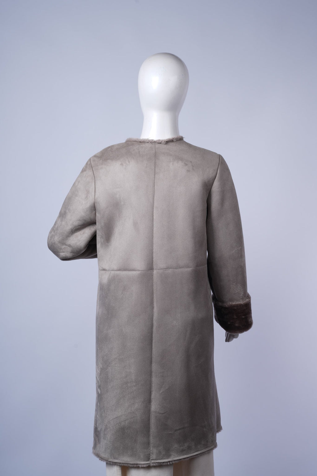  Warm sueded jacket with dark fur lining, perfect for timeless casual styling.