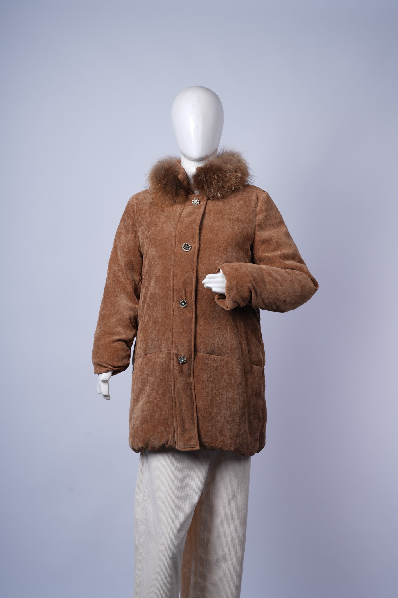 women's cozy brown corduroy jacket featuring warm quilted design and soft fur trim.