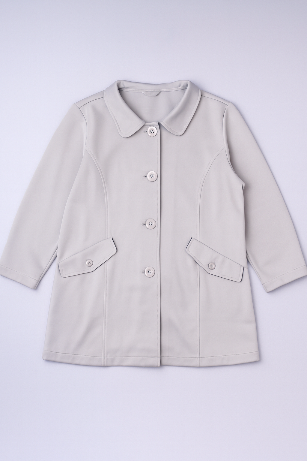 Long coat with lapel collar, multiple front buttons, and functional patch pockets.