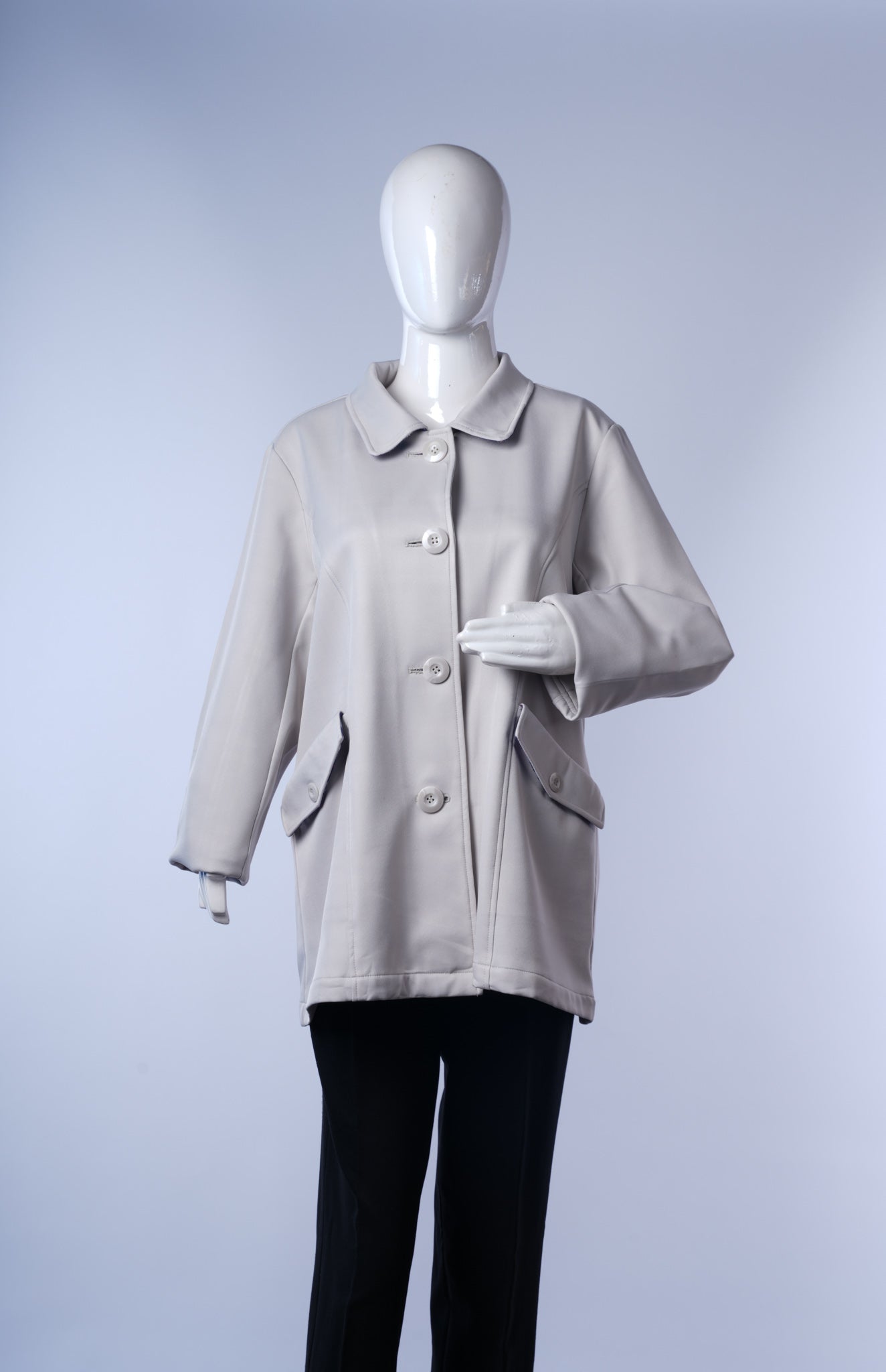 women's stylish long coat featuring contrasting inner lining and tailored design.