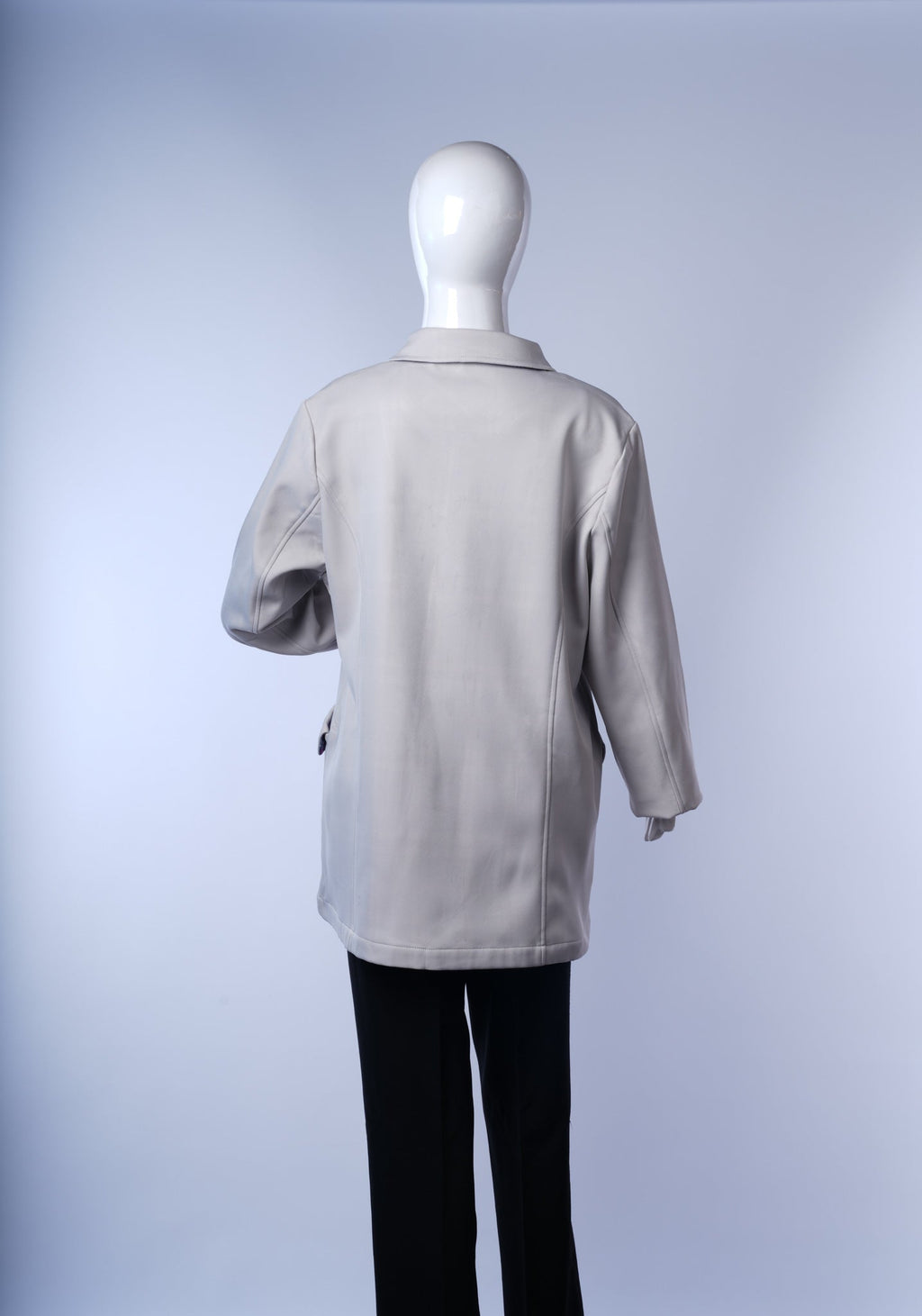 Versatile long coat perfect for layering, with functional pockets and chic interior detail.