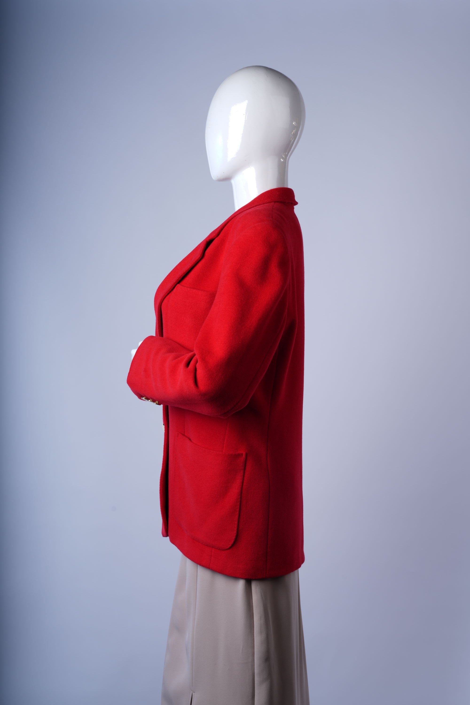 Elegant red blazer featuring classic notched lapels and structured design.
