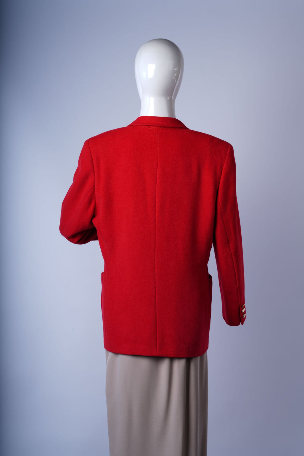 Stylish wool-blend red blazer perfect for professional or uniform-inspired outfits.