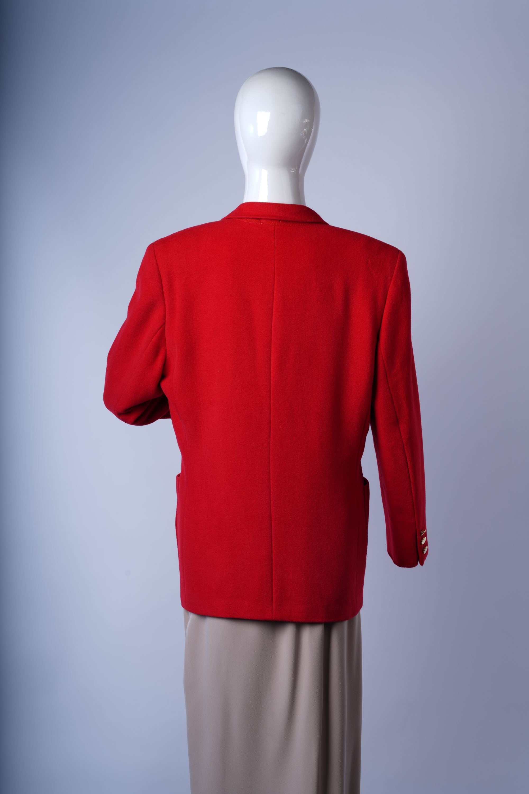 Stylish wool-blend red blazer perfect for professional or uniform-inspired outfits.