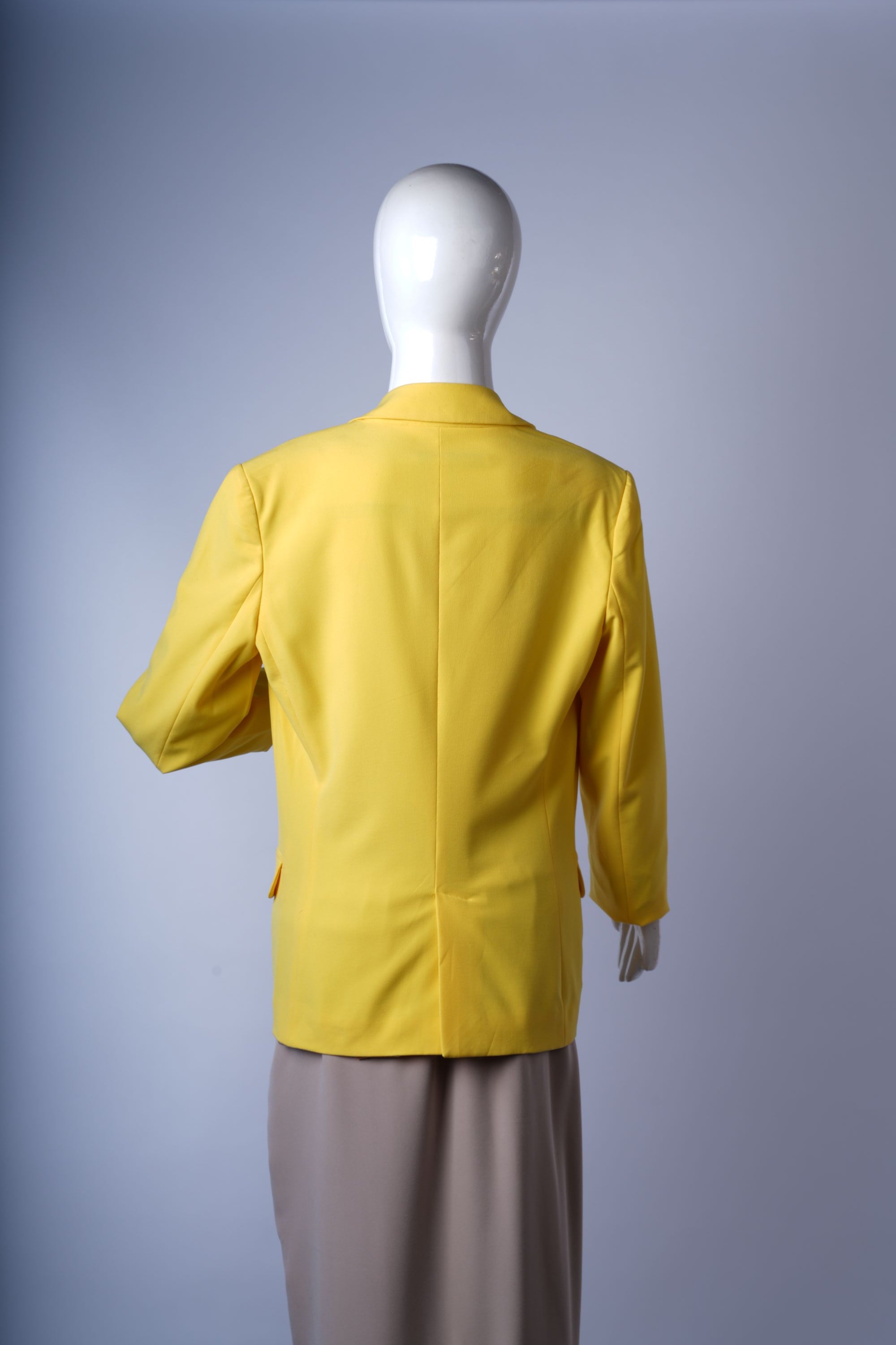 Vibrant yellow blazer perfect for layering over casual or smart-casual outfits.