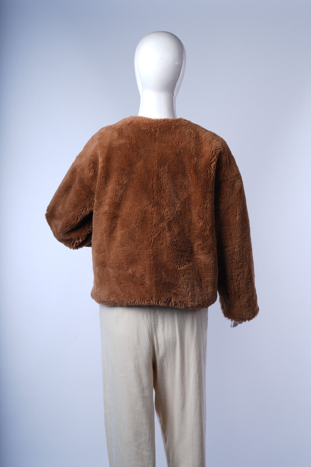 Elegant cropped faux fur jacket for women, ideal for winter wardrobes.