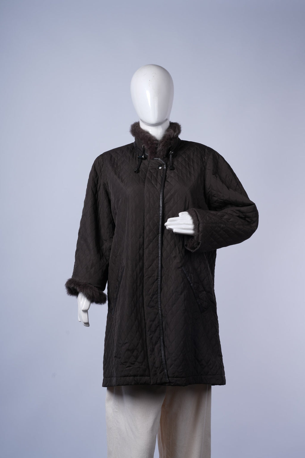 women's stylish quilted jacket ideal for casual or dressy cold-weather wear.