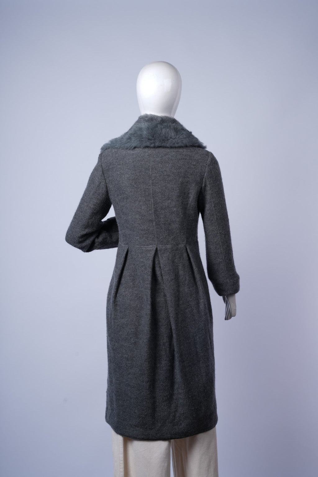  Sophisticated grey coat perfect for layering in cold-weather formal or casual outfits.