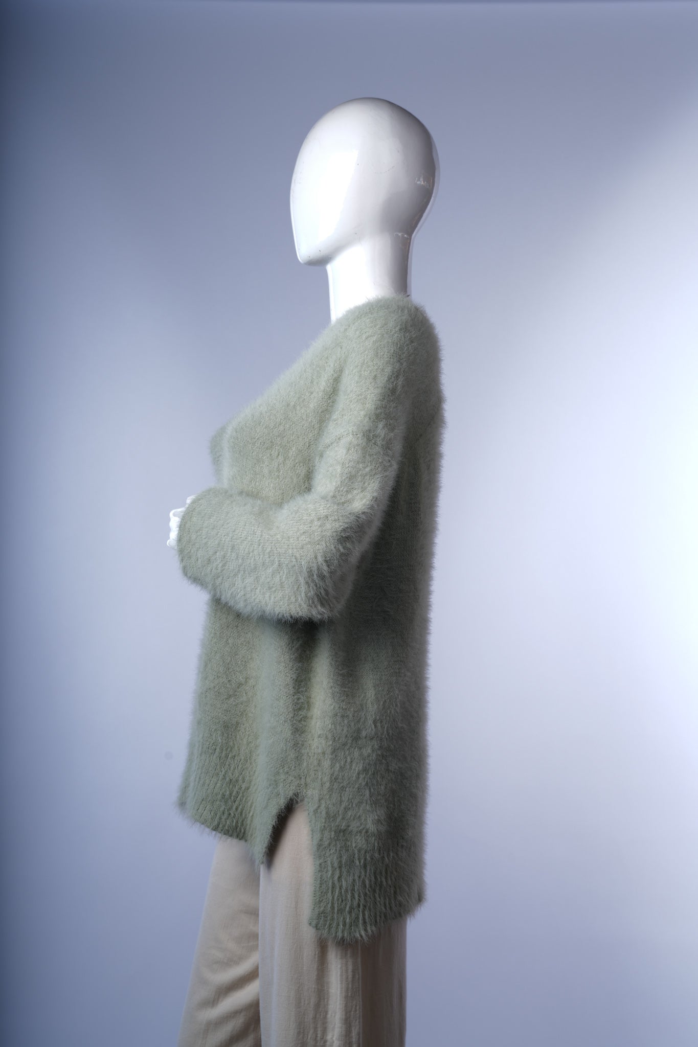 Cozy V-neck fuzzy sweater for women, ideal for casual layering.