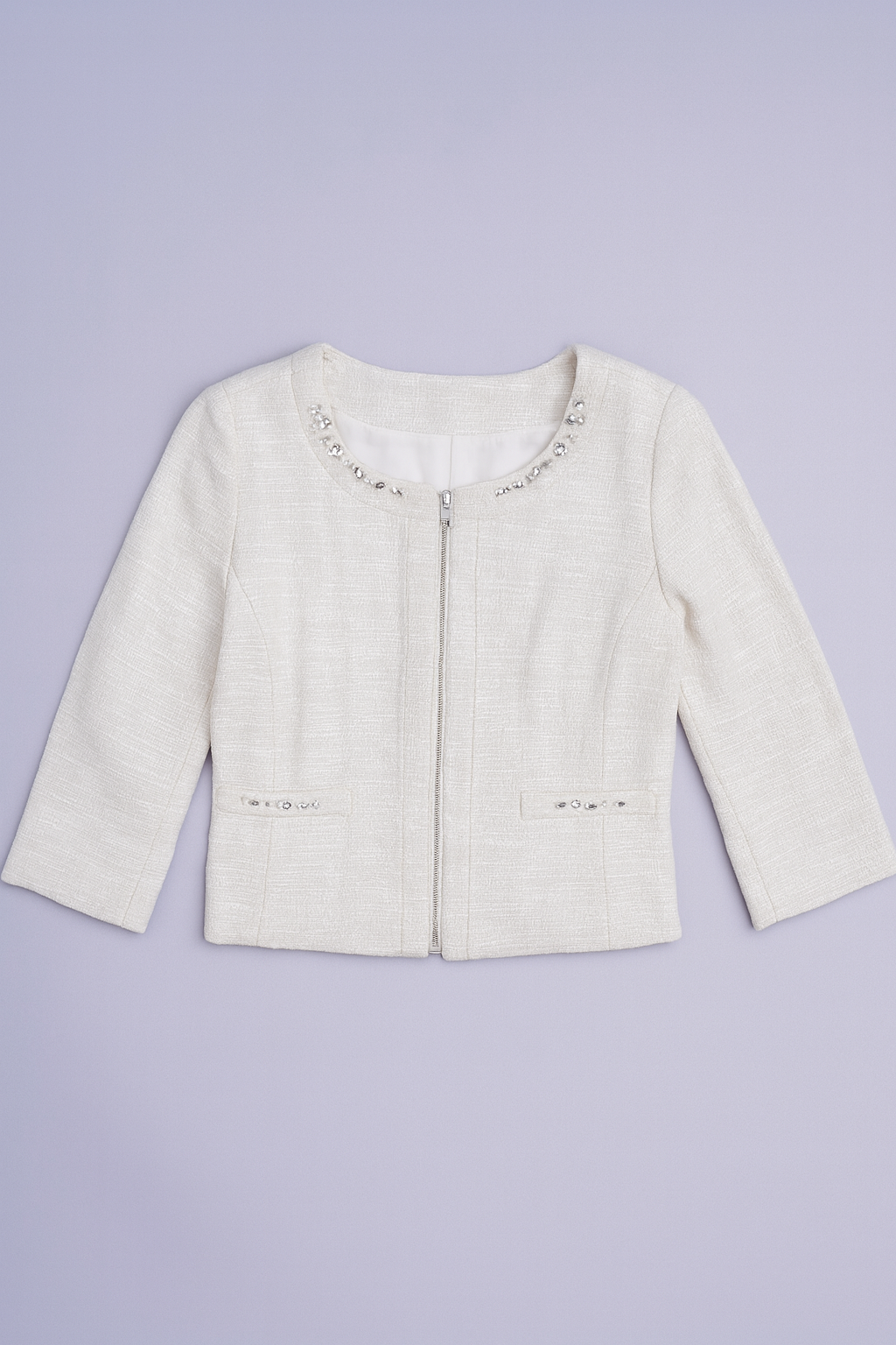 White tweed-style collarless jacket with beaded and sequin details on neckline and pockets.