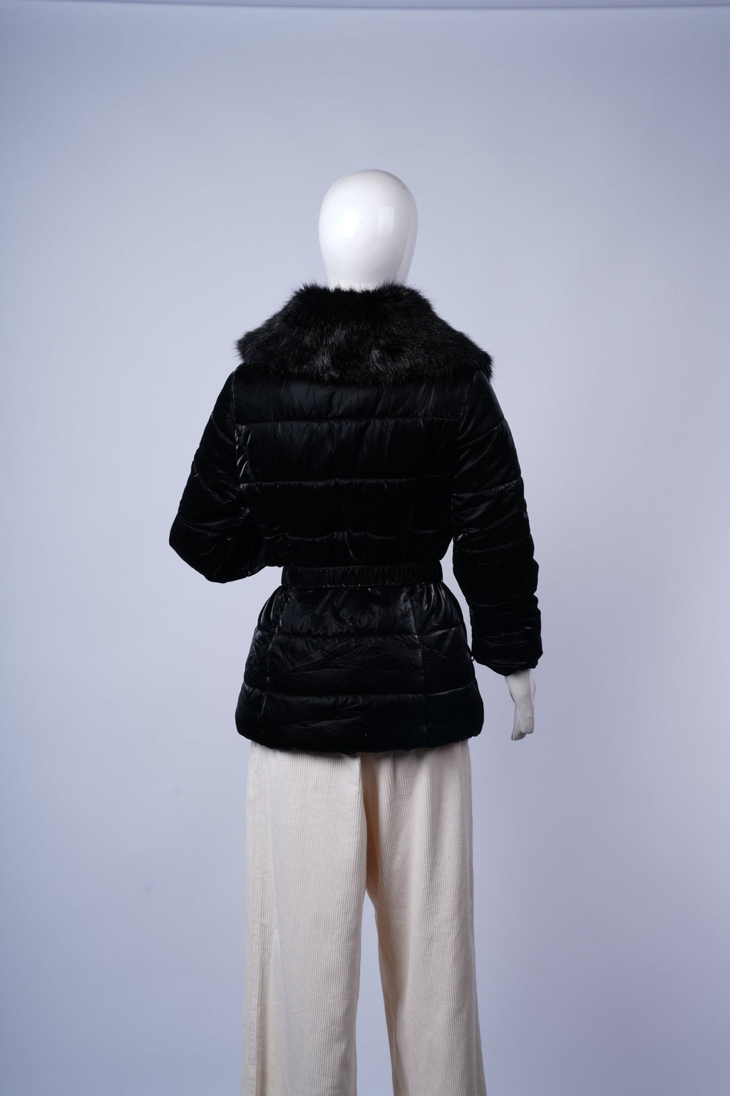 Cozy and elegant black puffer coat perfect for cold-weather outfits.