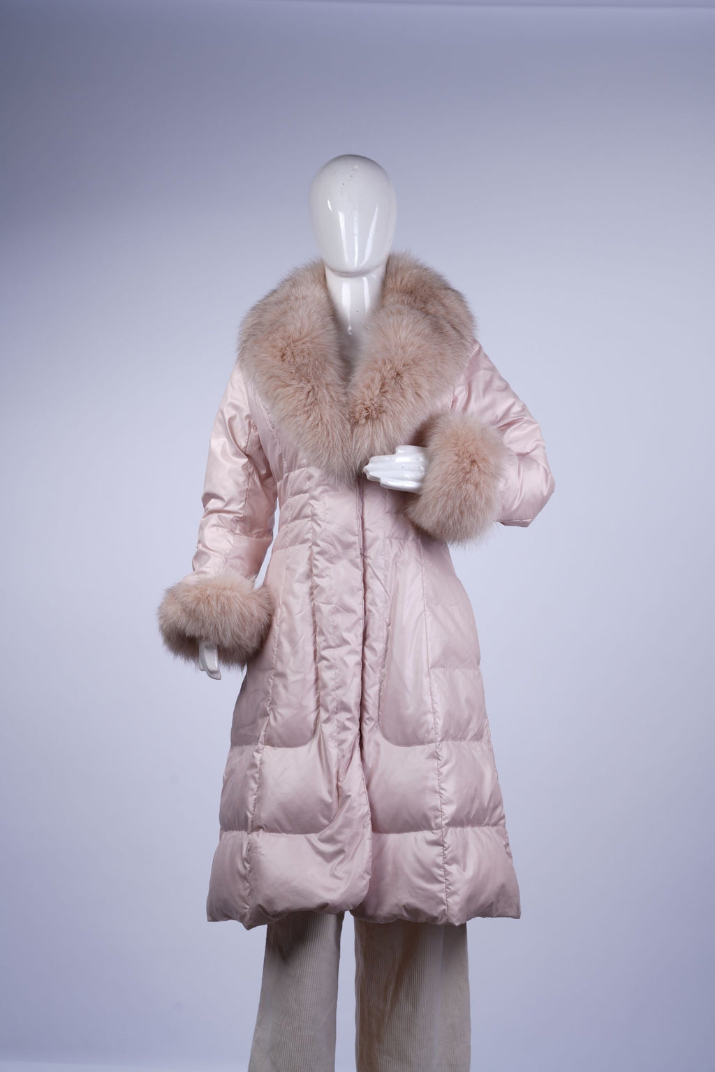 Cozy light pink women's winter jacket with plush fur-trimmed collar.