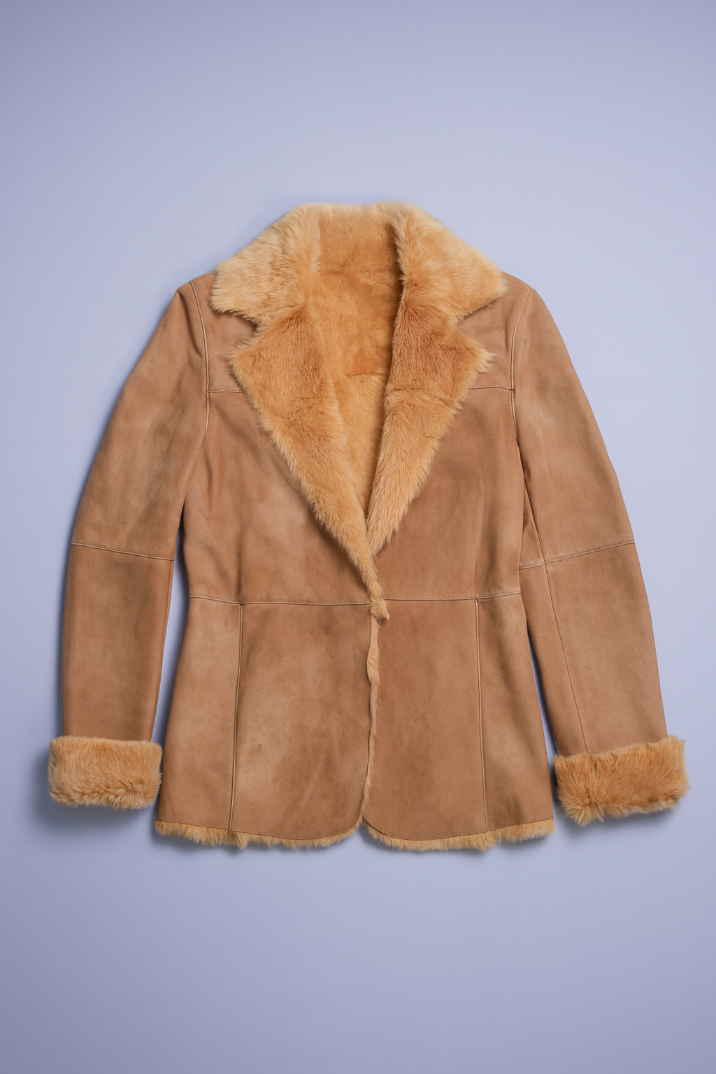 Tan jacket with suede exterior, plush shearling lining, and prominent collar.