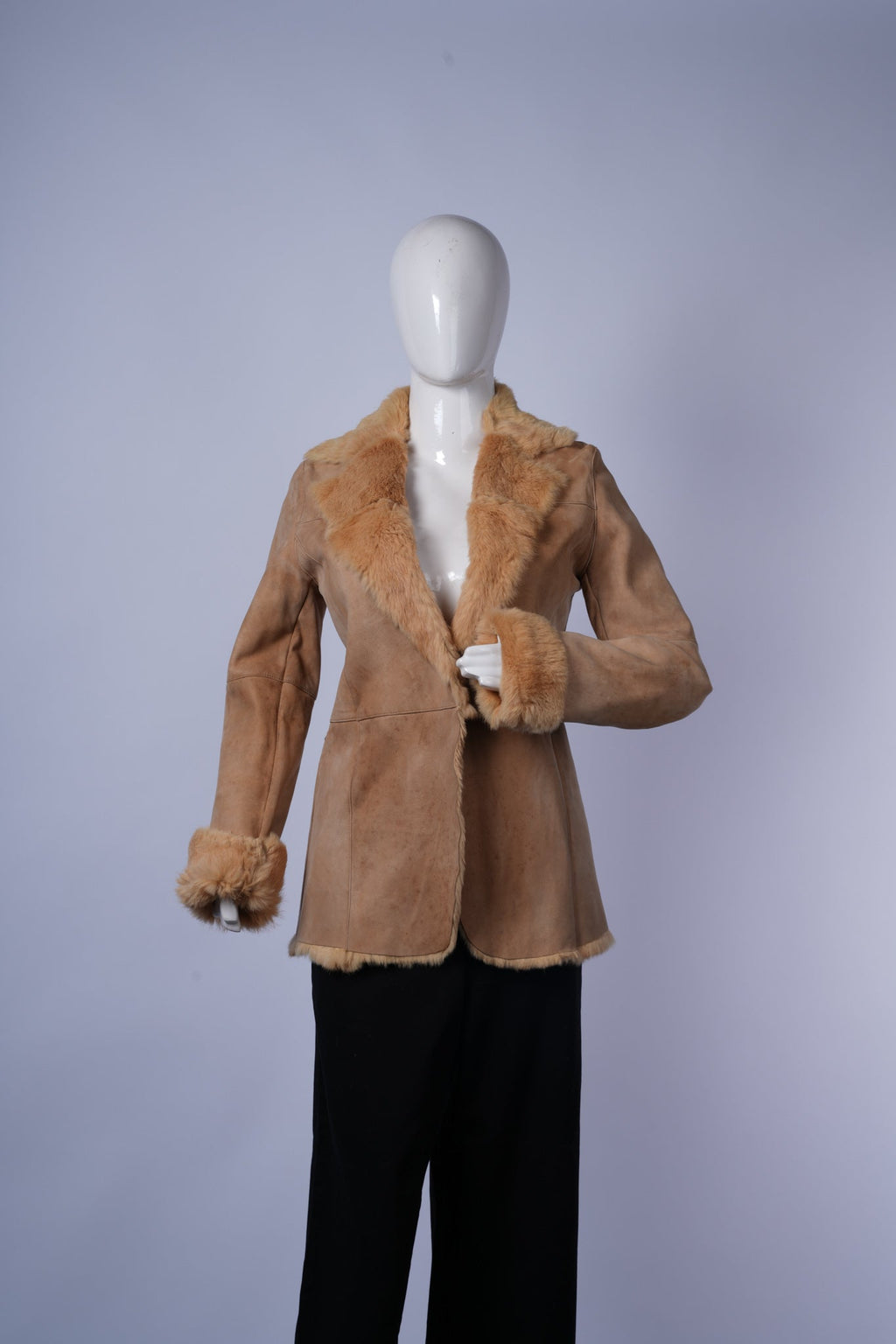 women's cozy shearling-lined jacket featuring rugged yet elegant design.