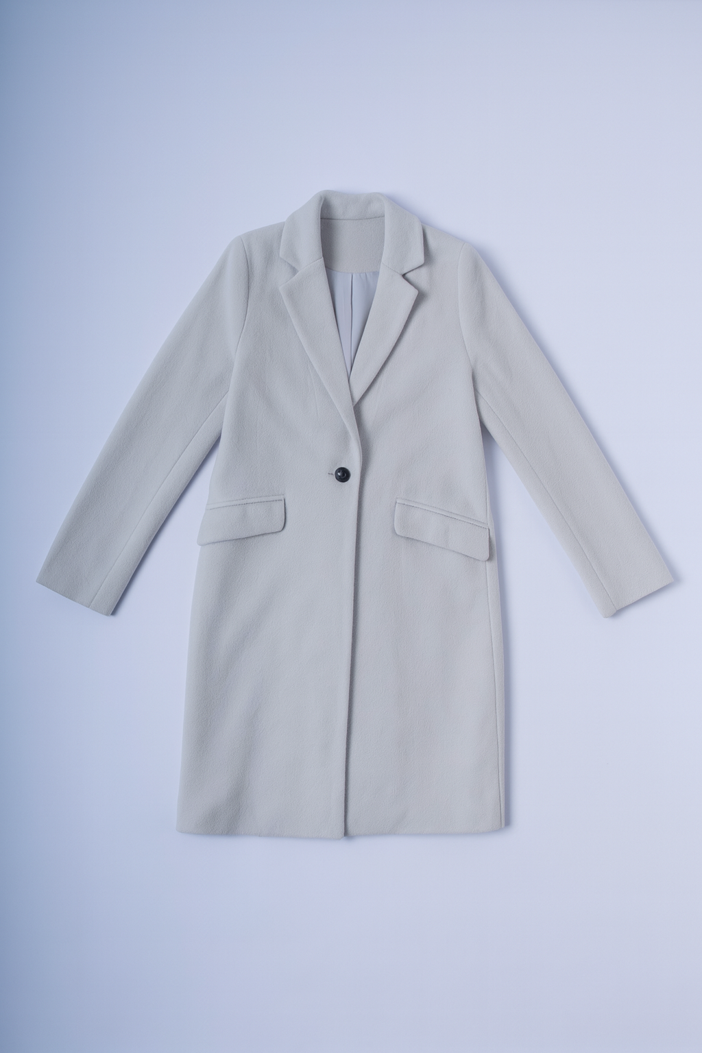 Elegant light gray coat with notched lapel collar and flap pockets.