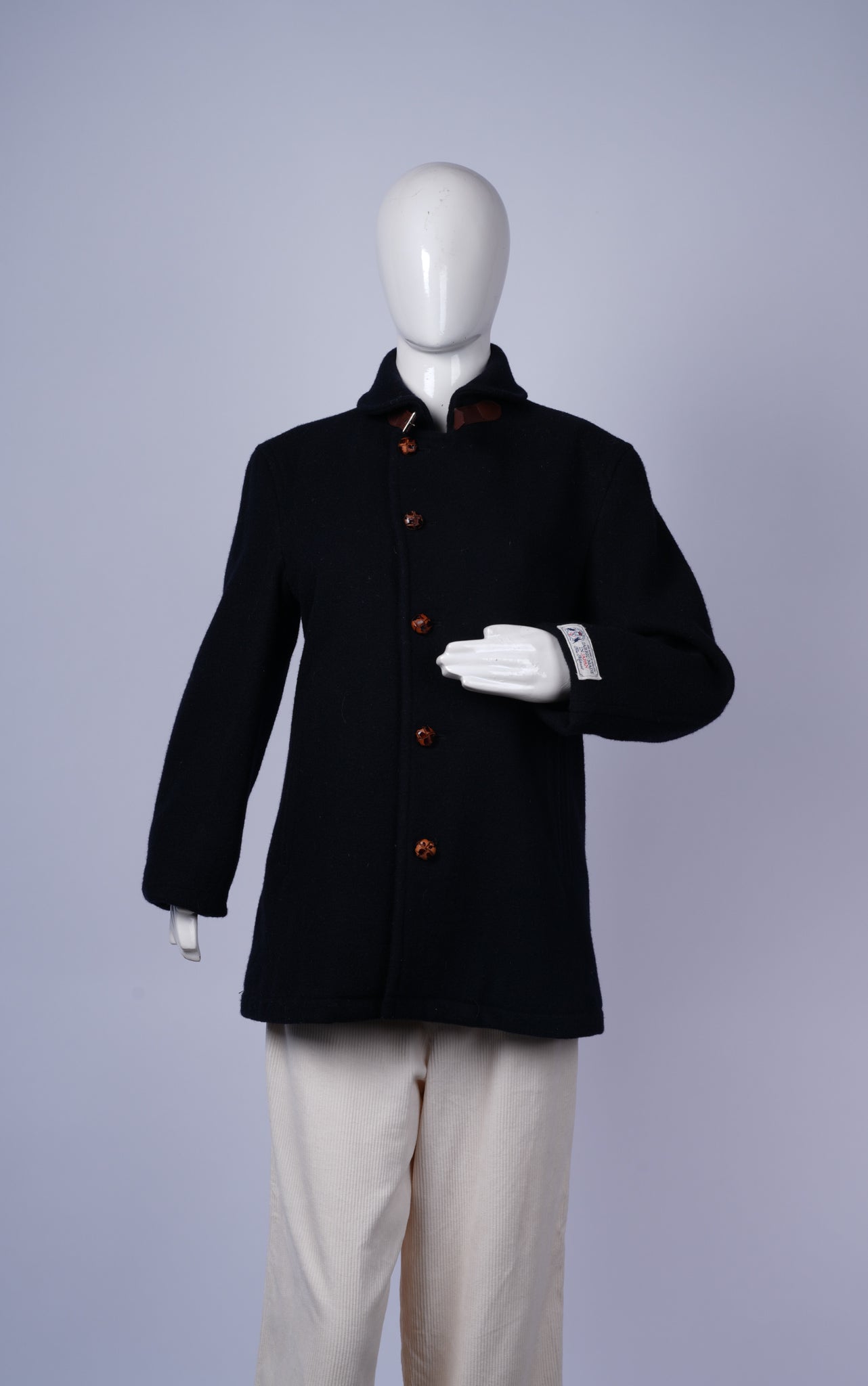 women's stylish navy pea coat featuring warm wool-blend fabric and tailored design.
